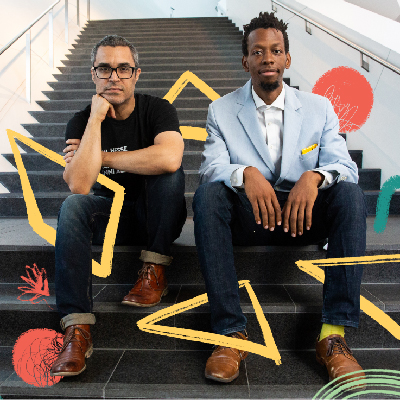 Ramon Bonilla and Brenton Weyi sitting on the steps of the DAM's staircase
