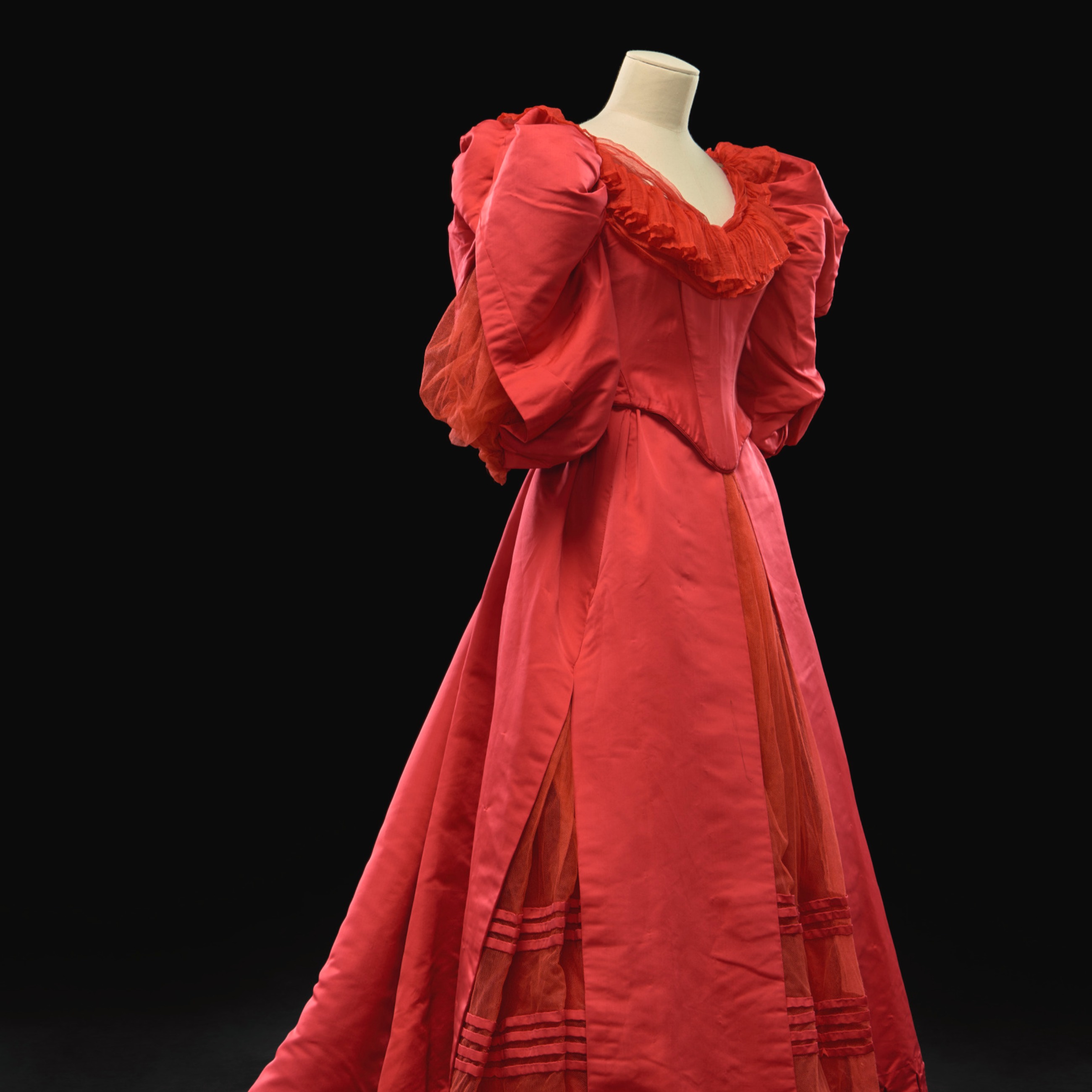A red ball gown by Charles Frederick Worth.