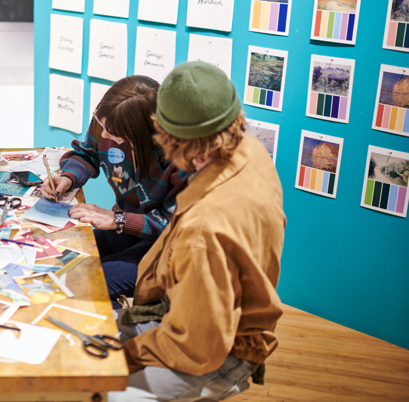 Two young adults at an artmaking station