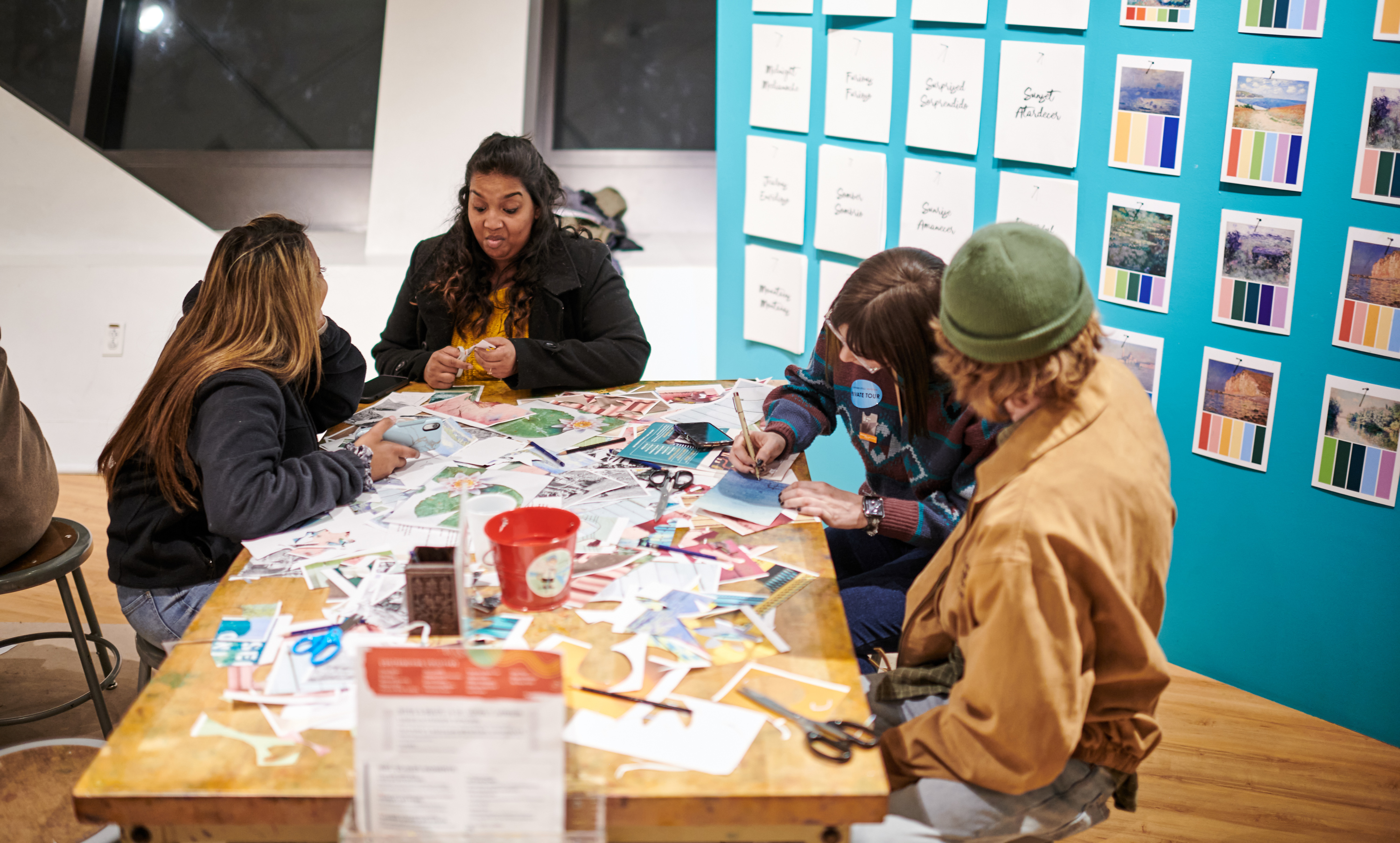 Young people gathered at an artmaking table