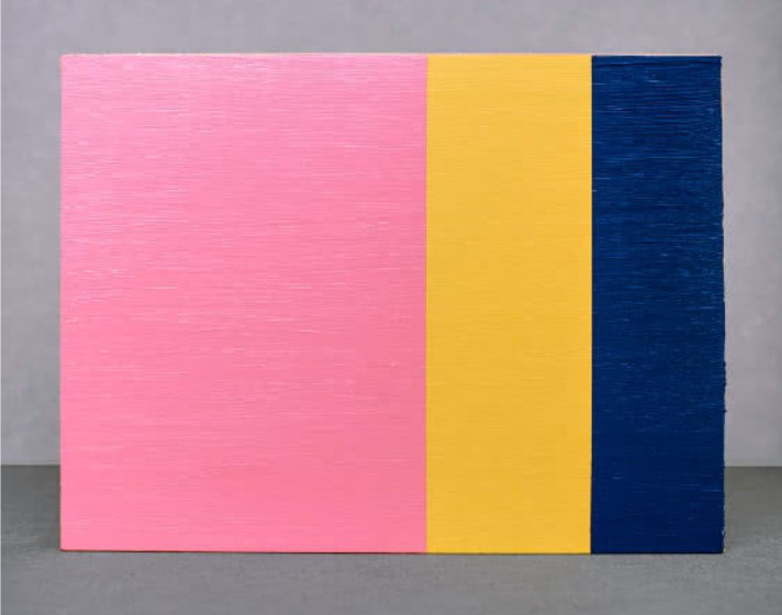 Brightly colored geometric pattern on a rectangular printed card.