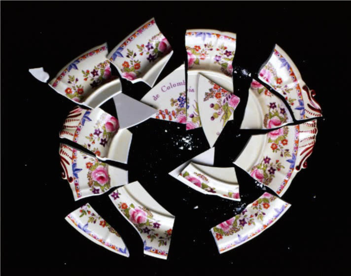 Series of ten digital prints hung in a horizontal line. From left to right, the images depict the transformation of a platter from intact to progressively more shattered, and finally into a fine, white powder.