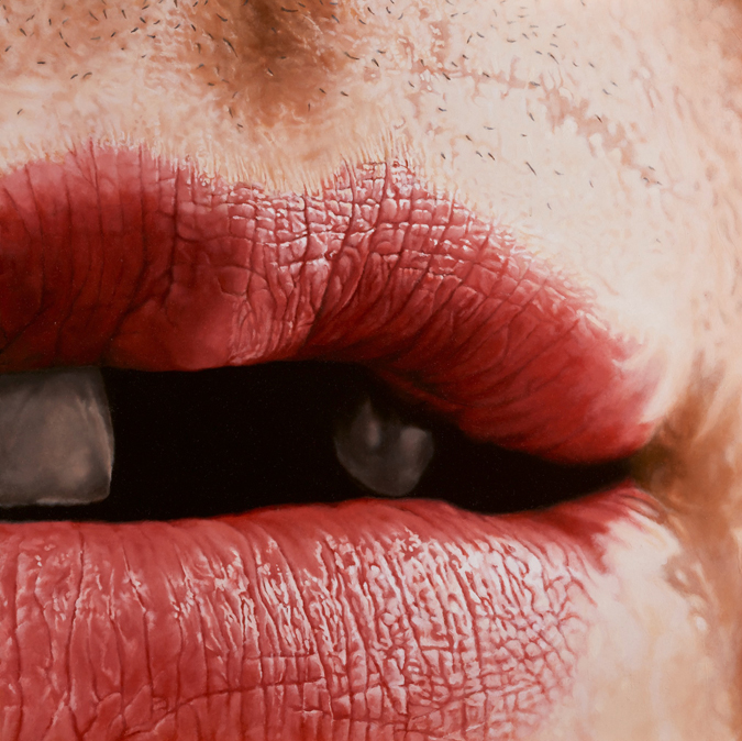 Close-up of a woman's mouth with a hint of stubble