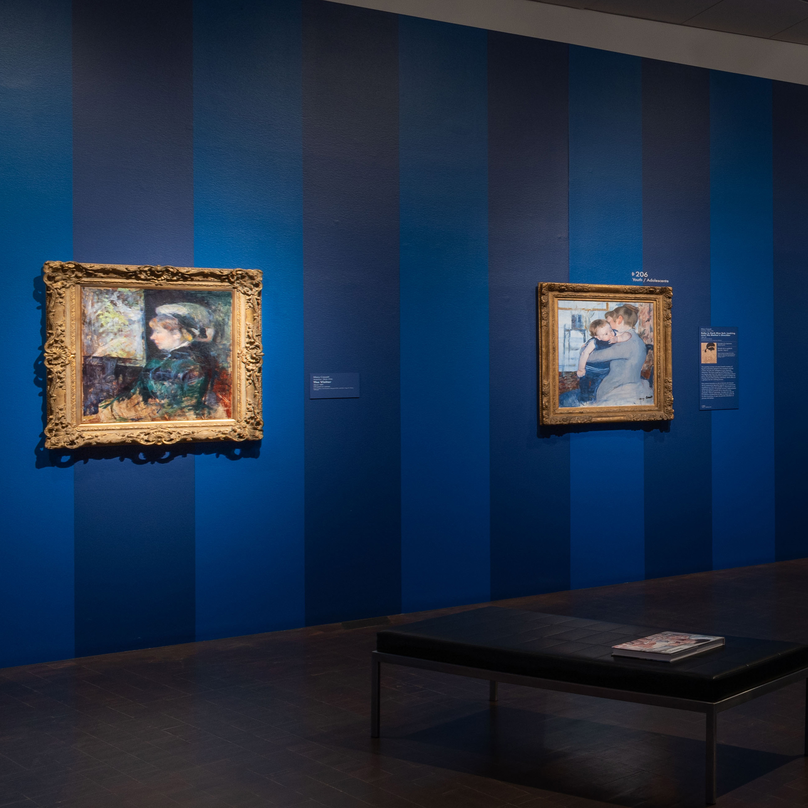 2 Impressionist portraits of women by Mary Cassatt in elaborate gold frames on the wall in the Whistler to Cassatt exhibition