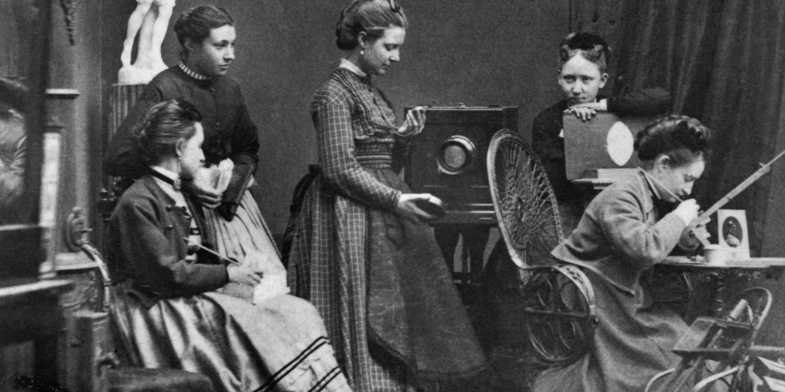 A black and white photograph of women.