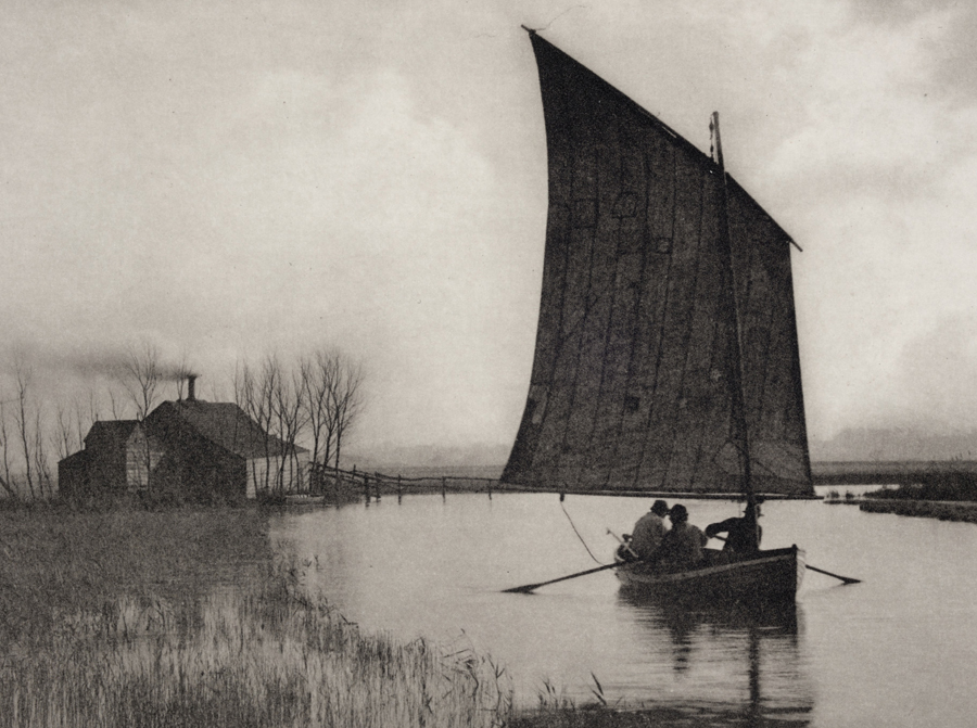 Black and white photograph of men on a sailboat