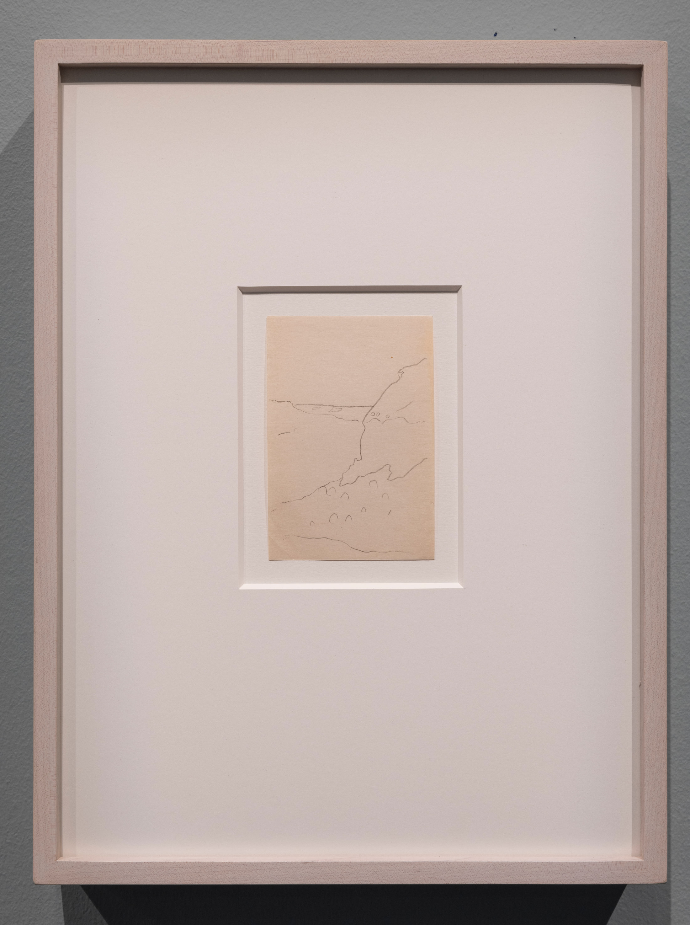 A minimalist line drawing on paper with simple shapes that create an outline of a canyon.