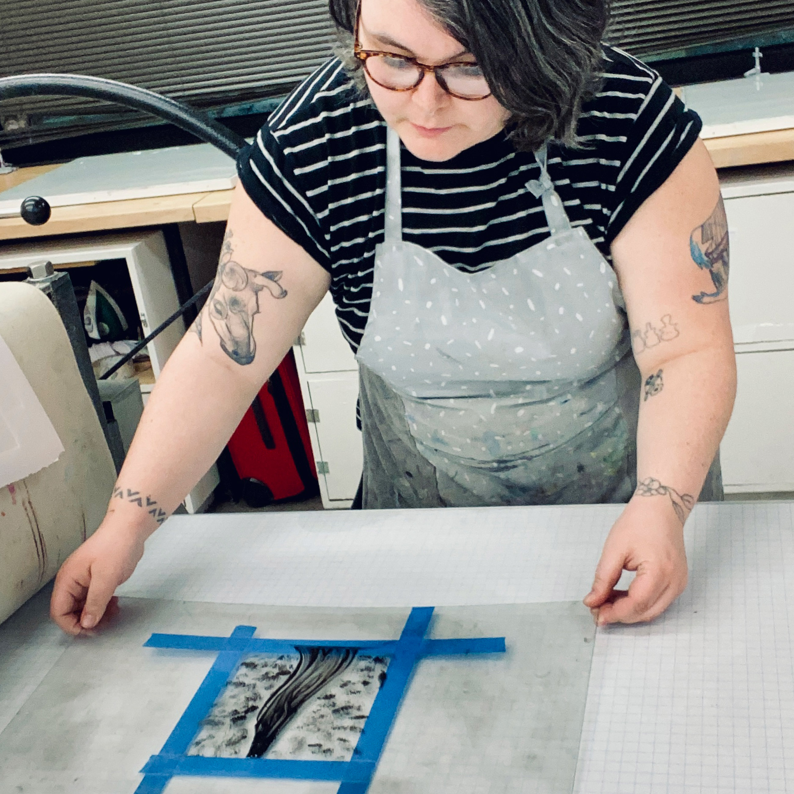 Finley Baker at work on a print