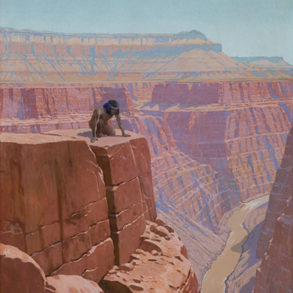 Man peering over the edge of a cliff in the Grand Canyon