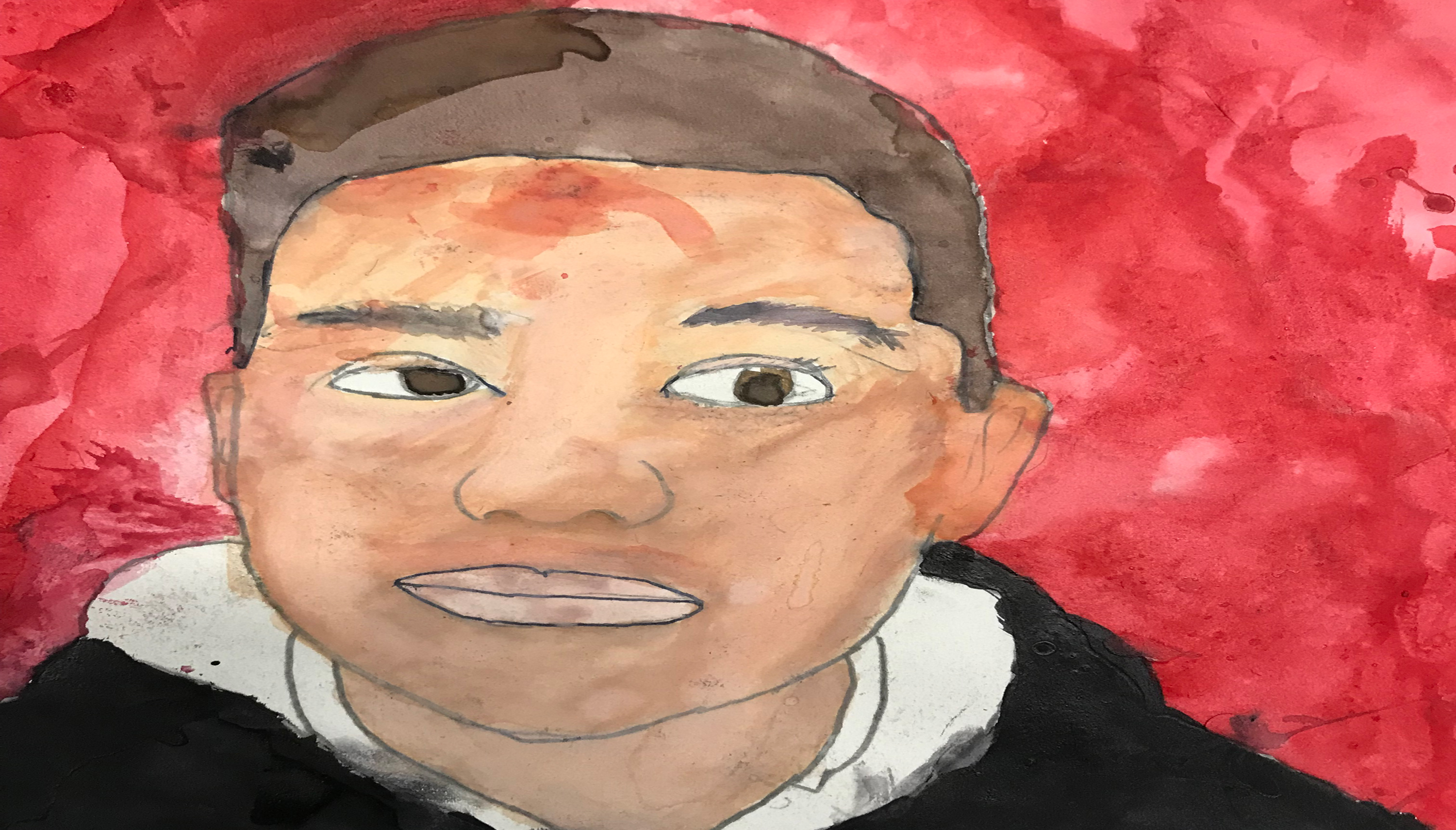 Portrait of a young African American student against a bright red background