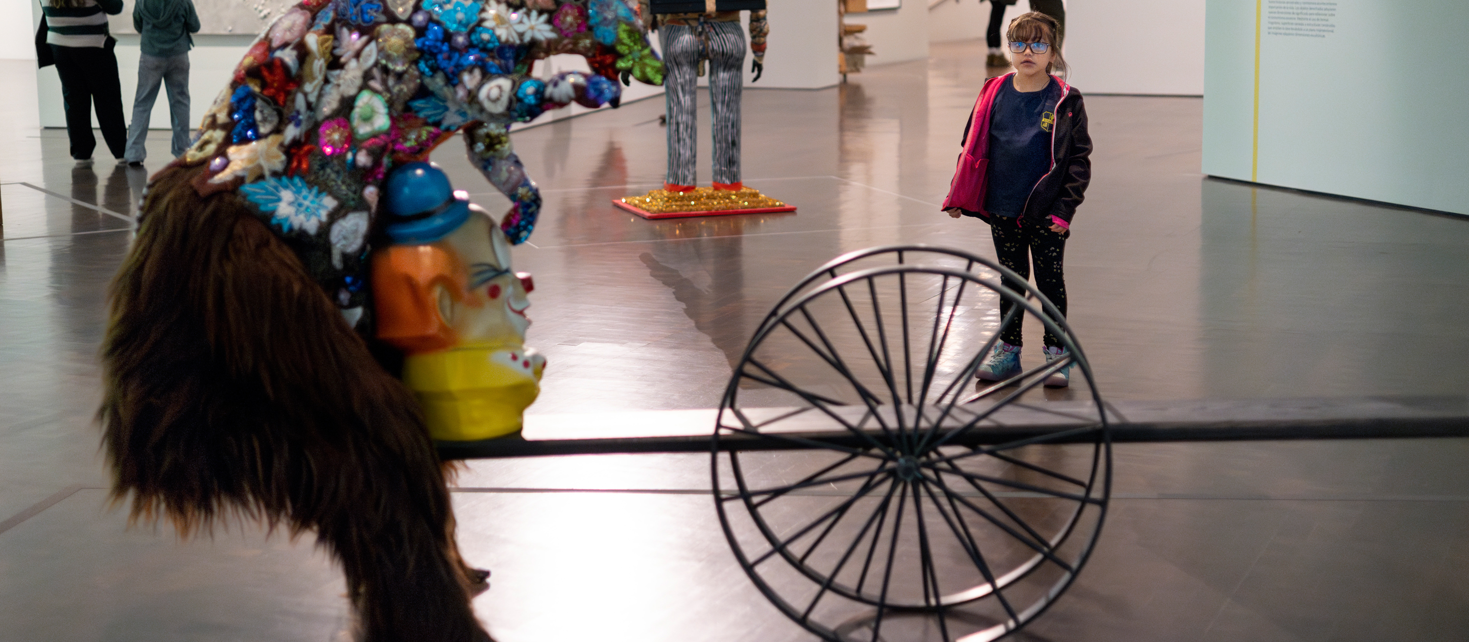 Young girl in front of 3D art sculpture in modern and contemporary galleries