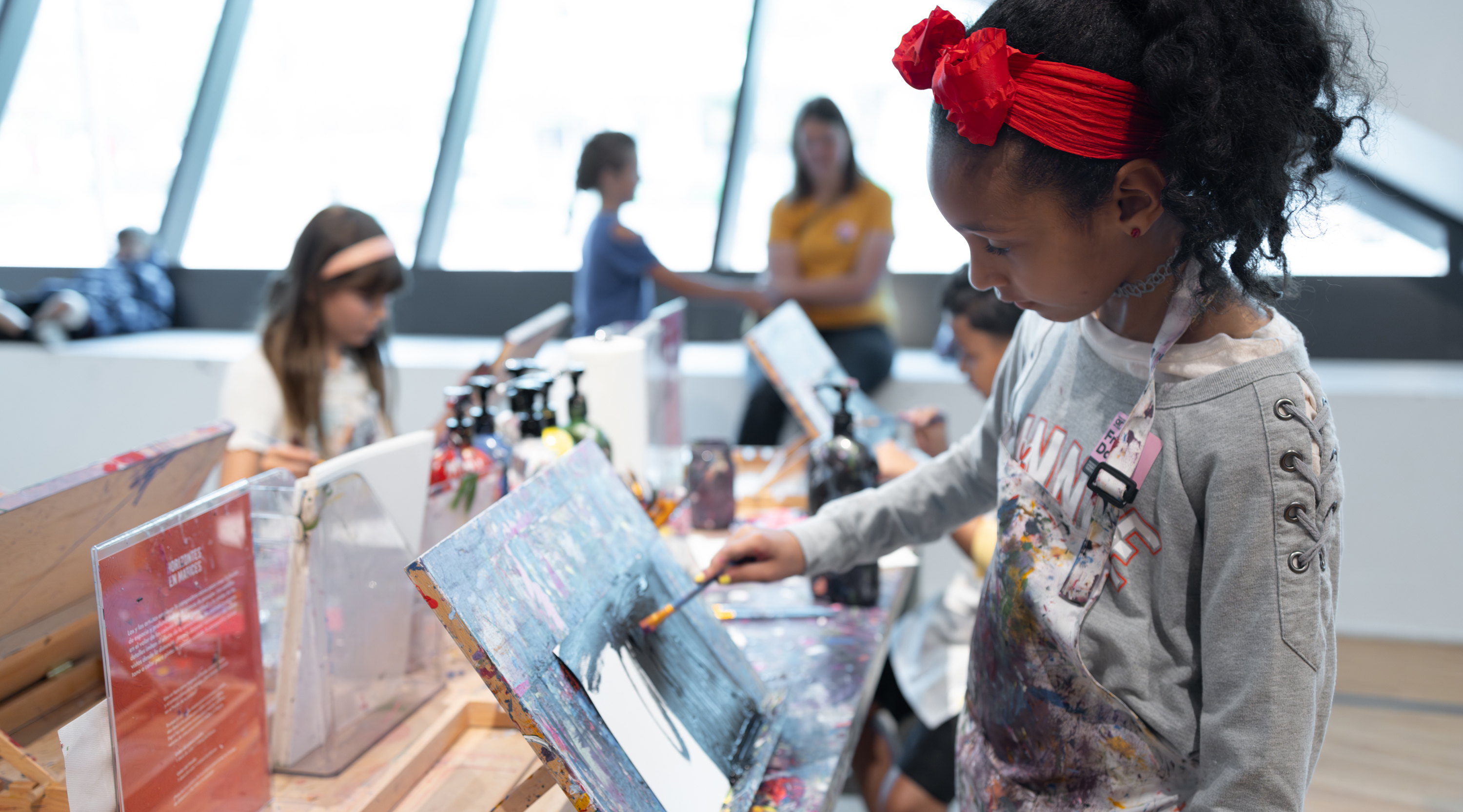 Young girl making art in the studio