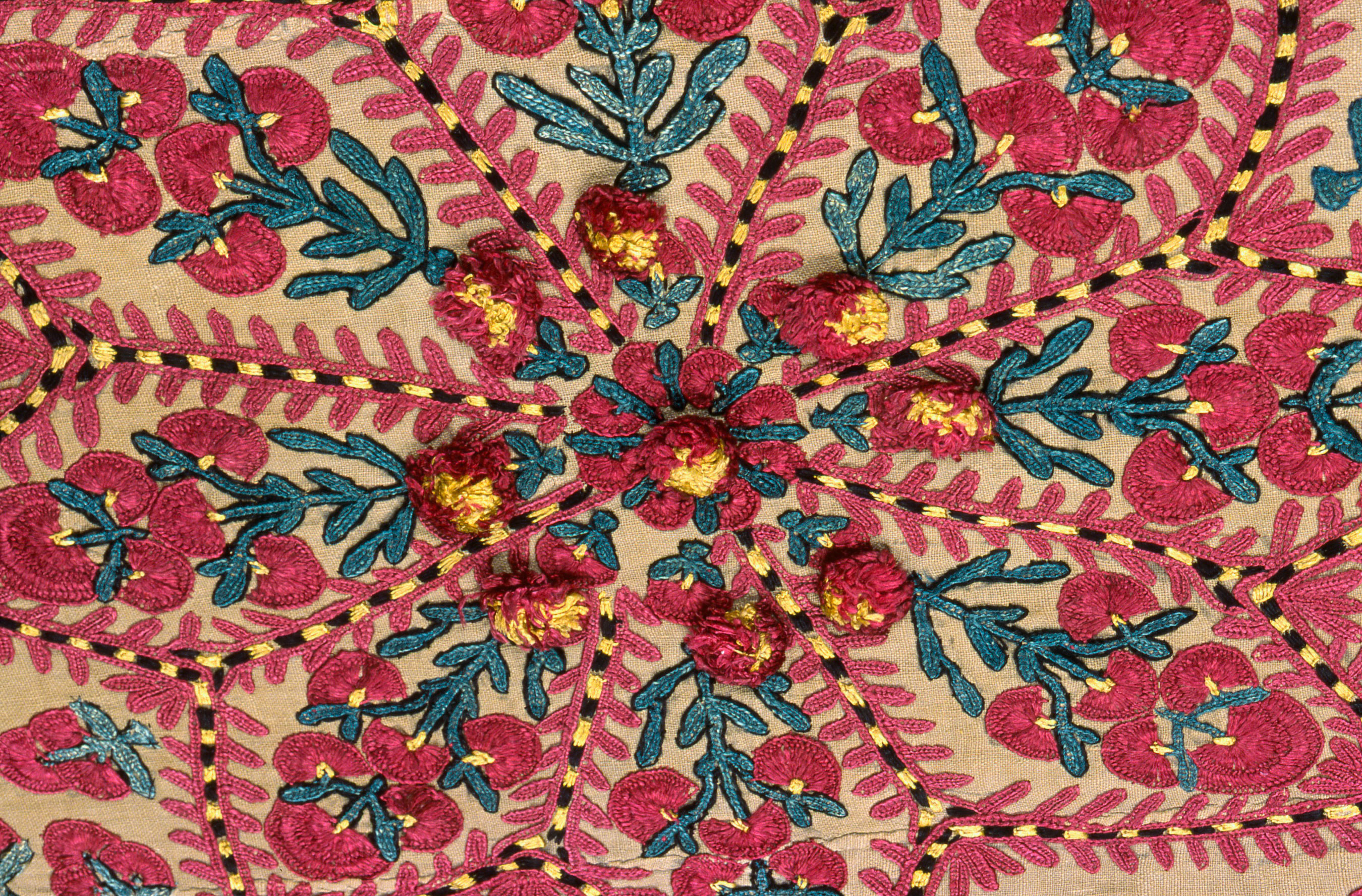 Detailed view of a bright red and swirling floral pattern