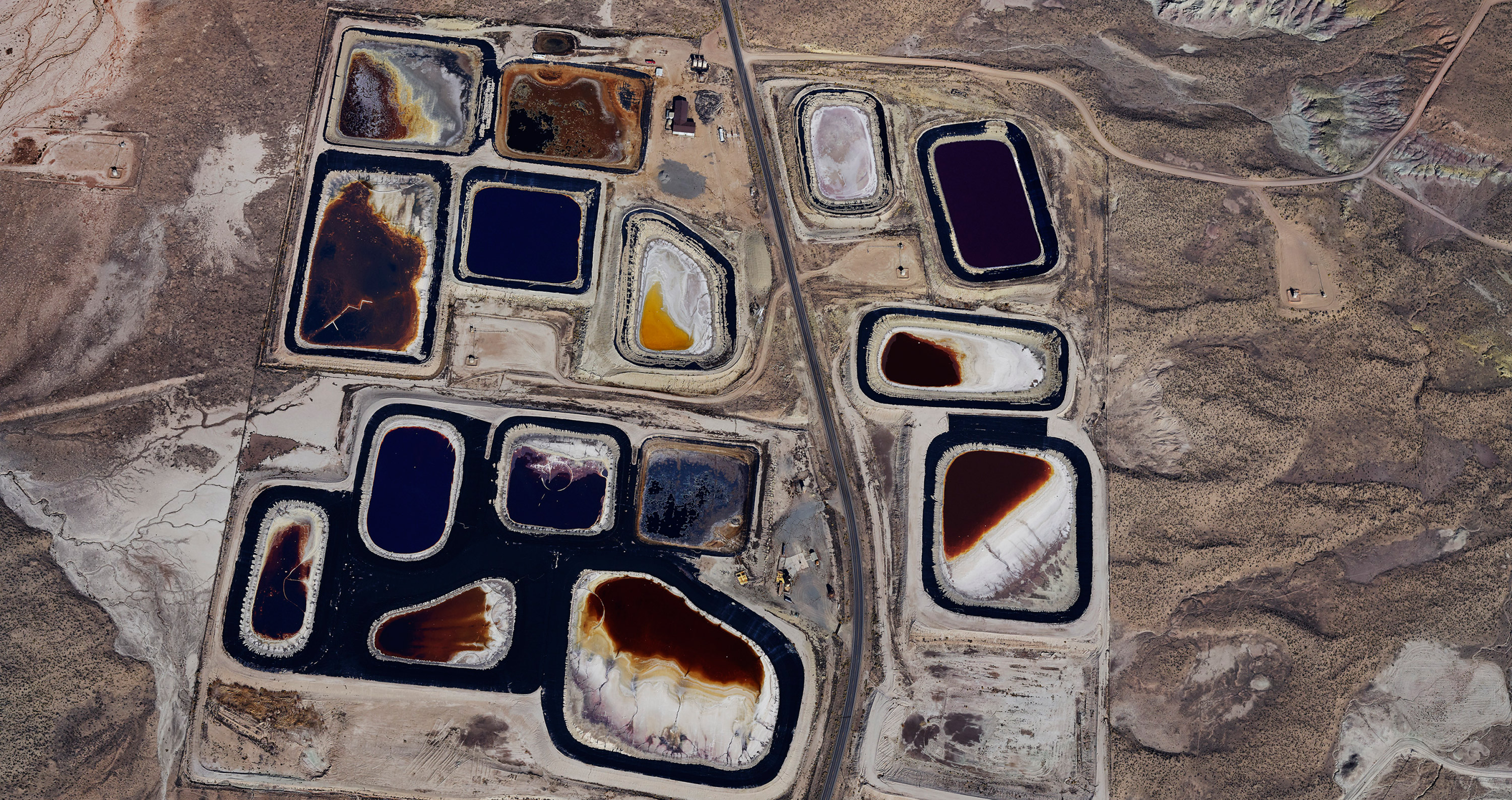 Aerial view of blue mineral deposit in a desert landscape