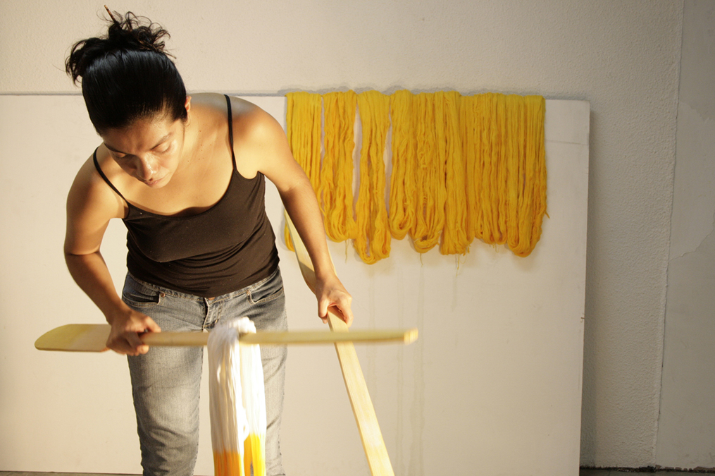 A woman working on an art project in hero studio