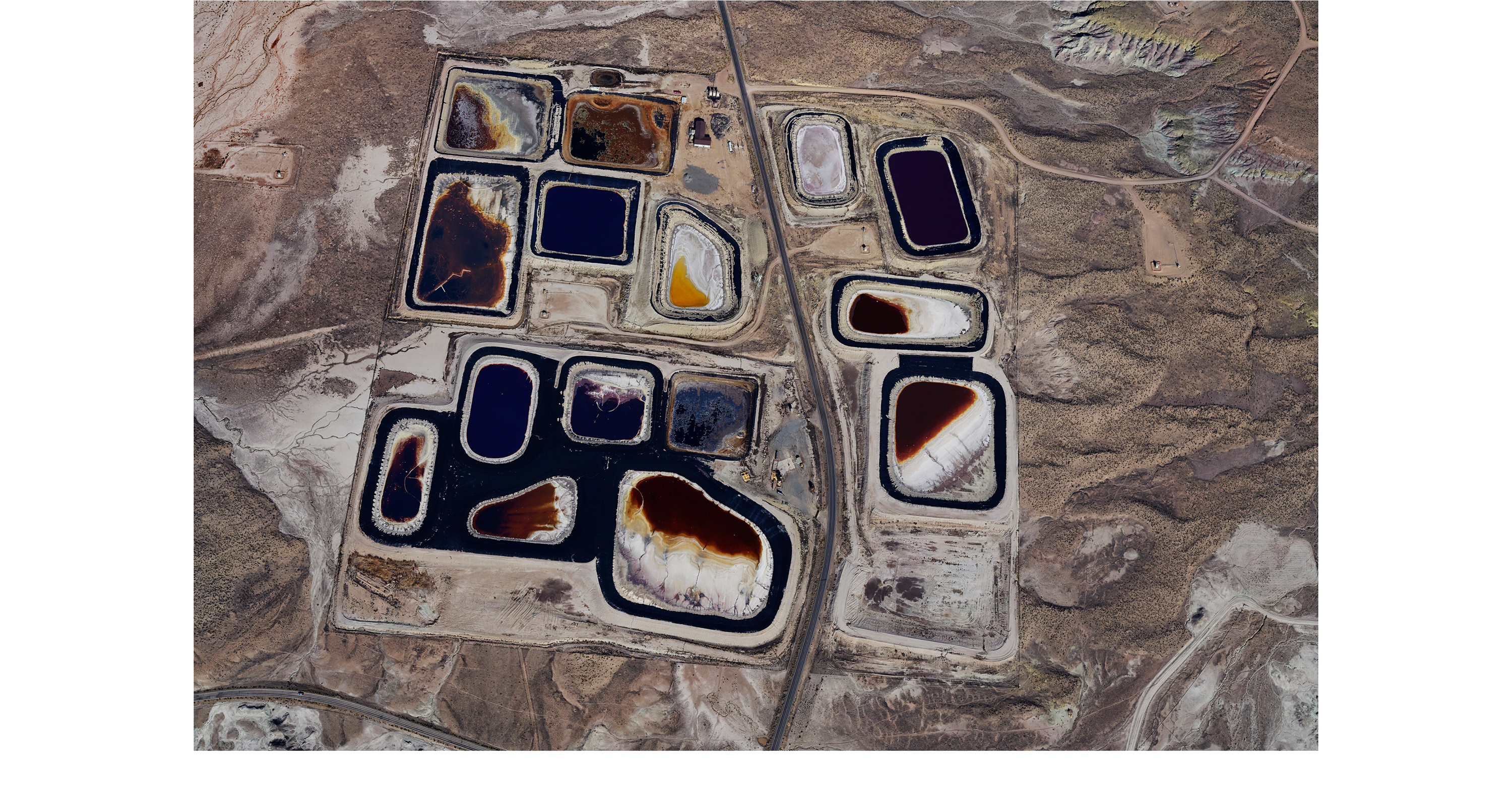 Aerial view of blue mineral deposit in a desert landscape