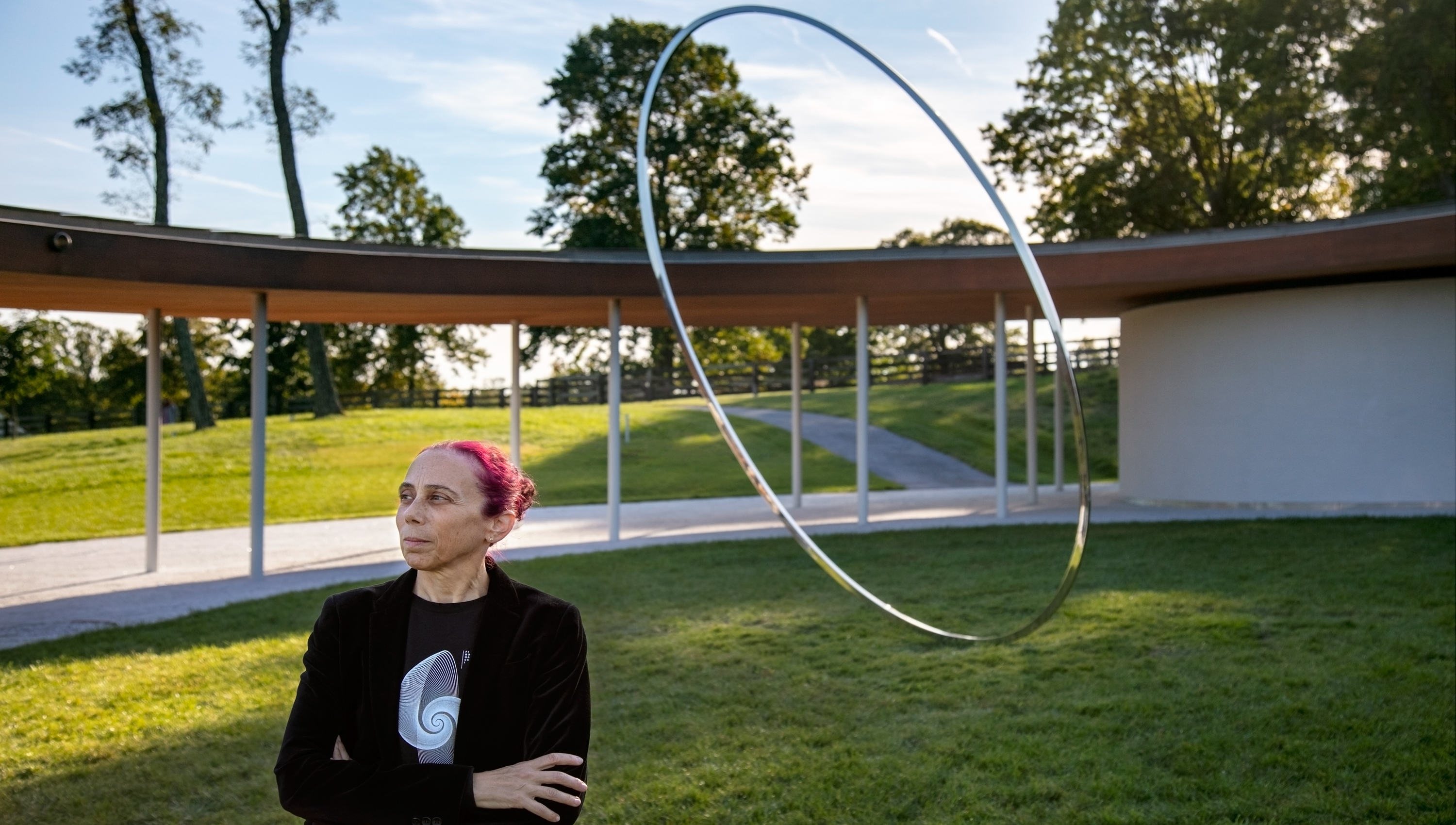Large abstract circular ring-like steel artwork
