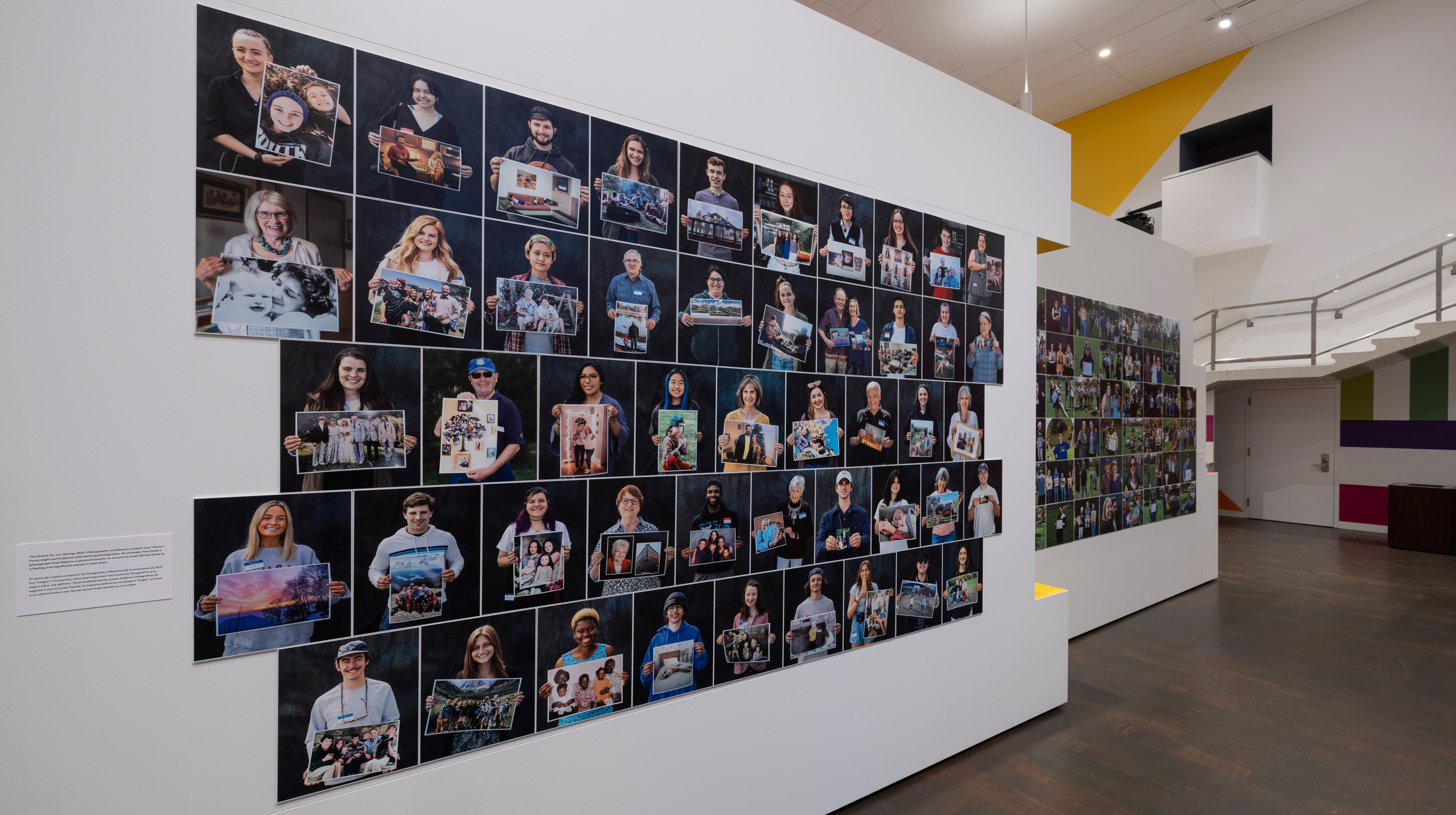 Installation view of a collage of headshots of people