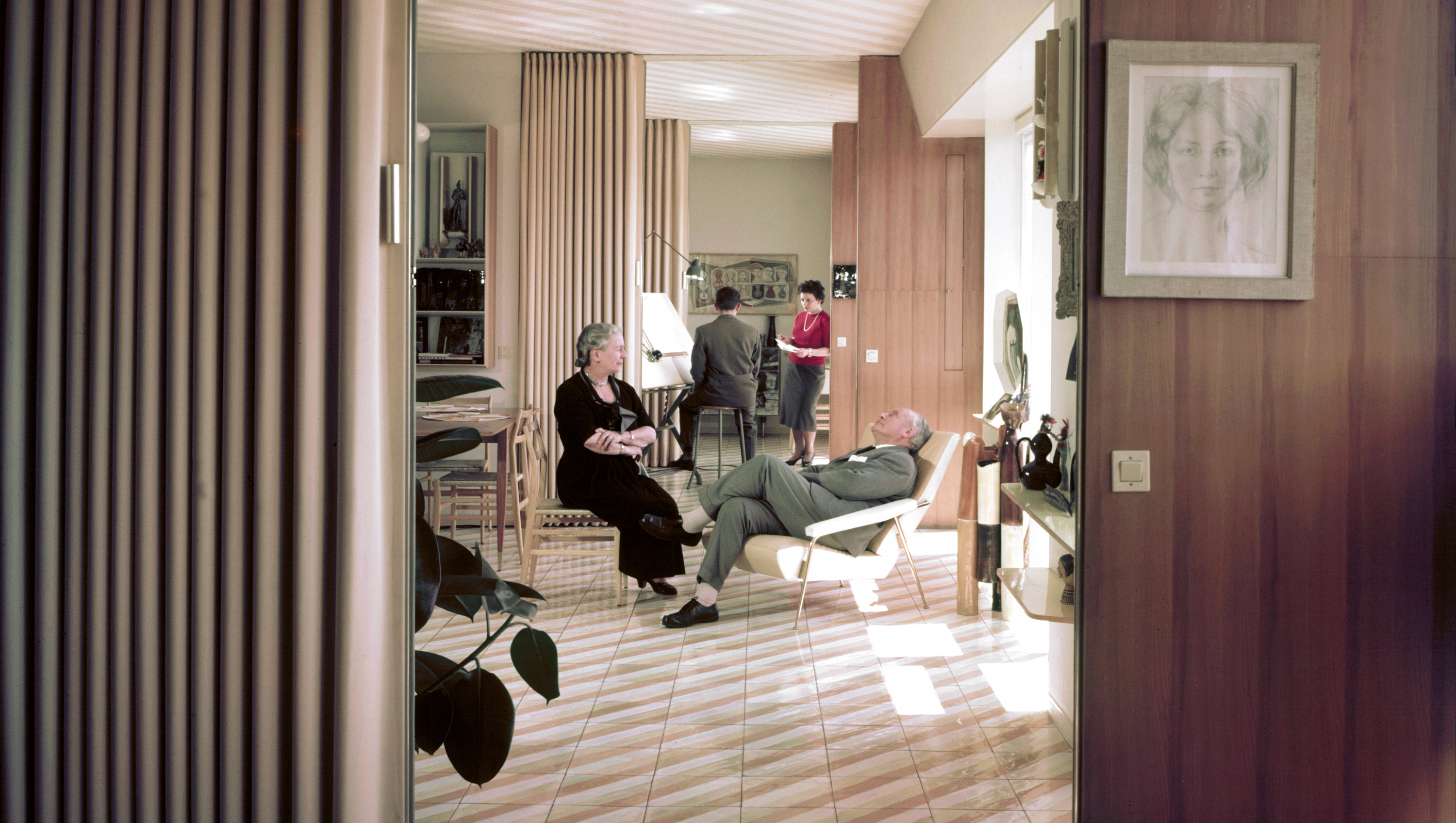 Gio Ponti and wife sitting in chairs he designed