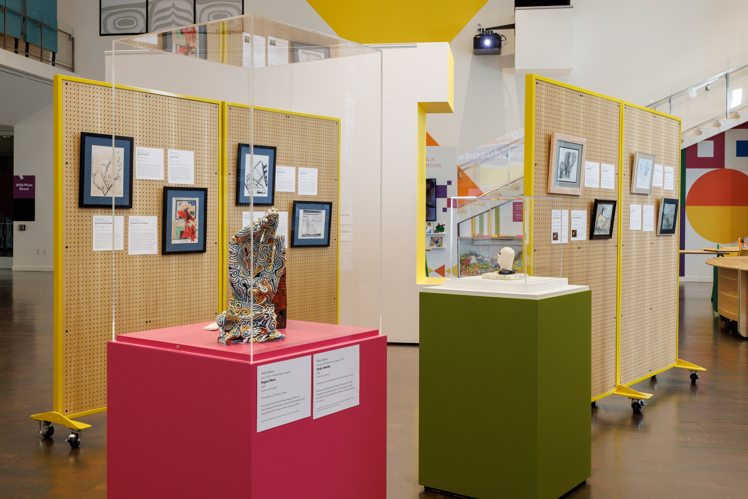 Gallery view of peg boards displaying several drawings