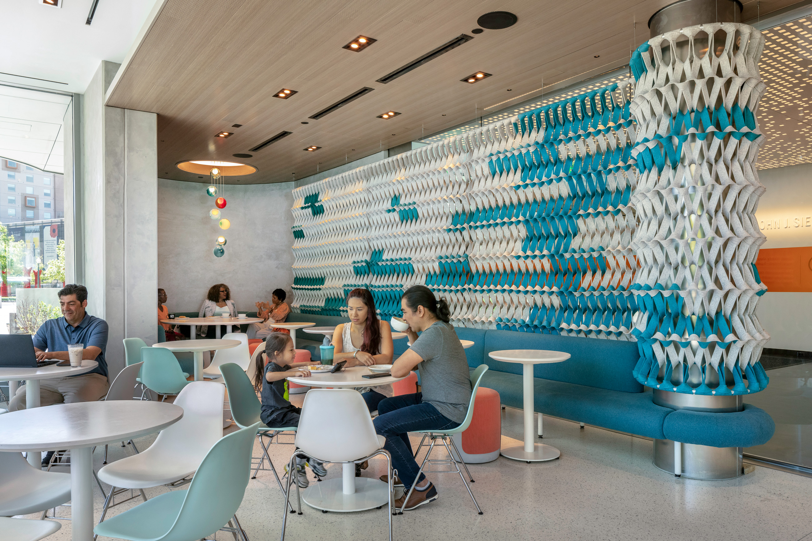 Visitors dining at tables in Cafe Gio