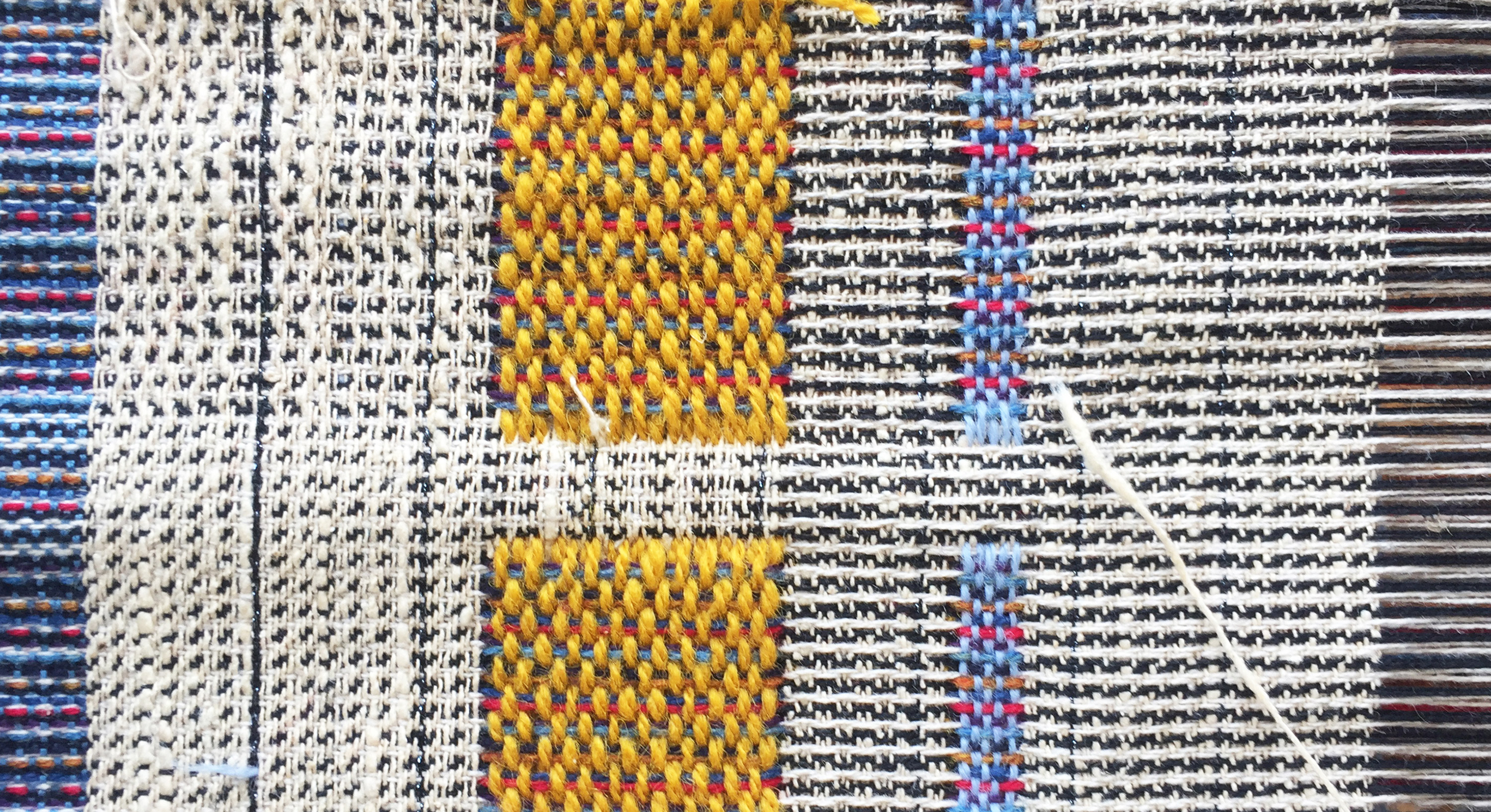 Woven tapestry with white and yellow colorblocks