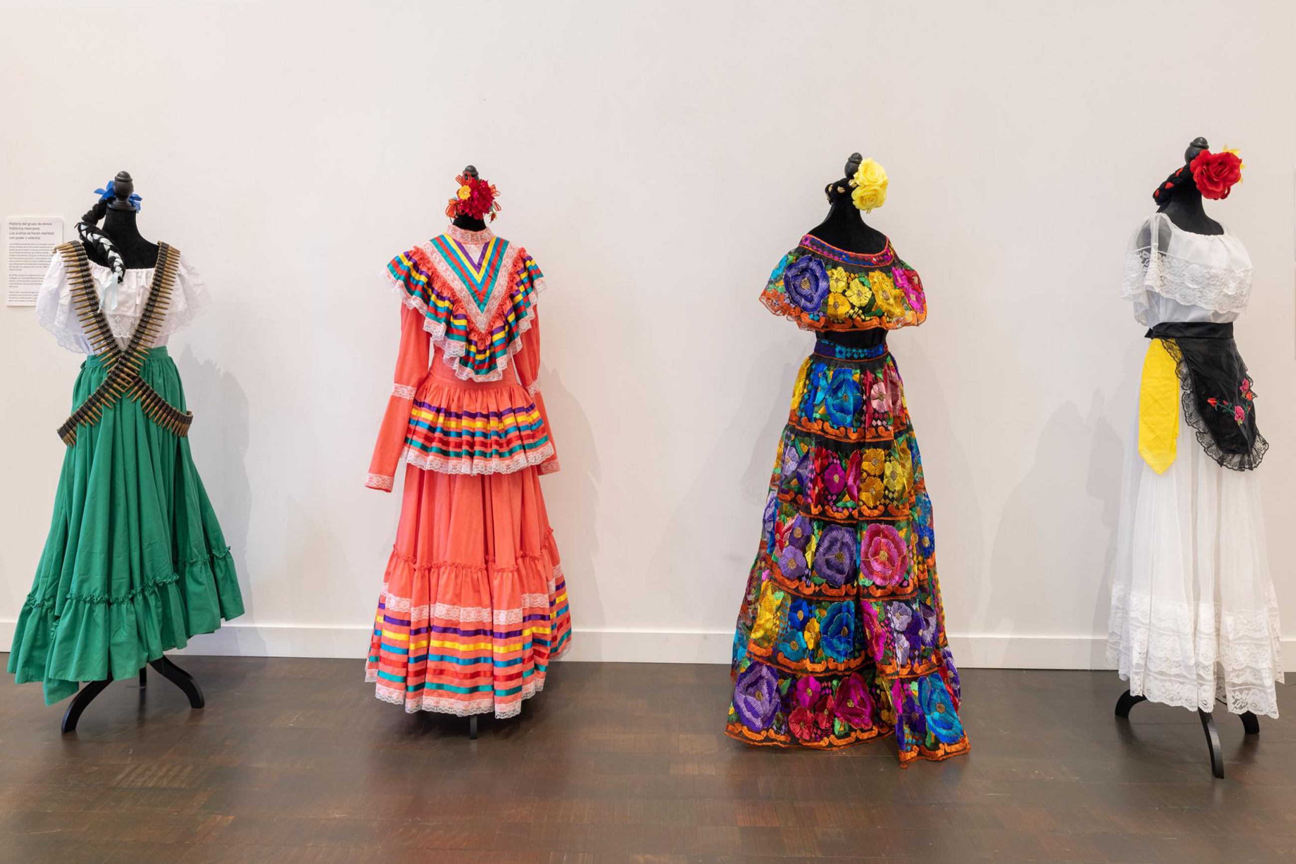 Four mannequins displaying dresses