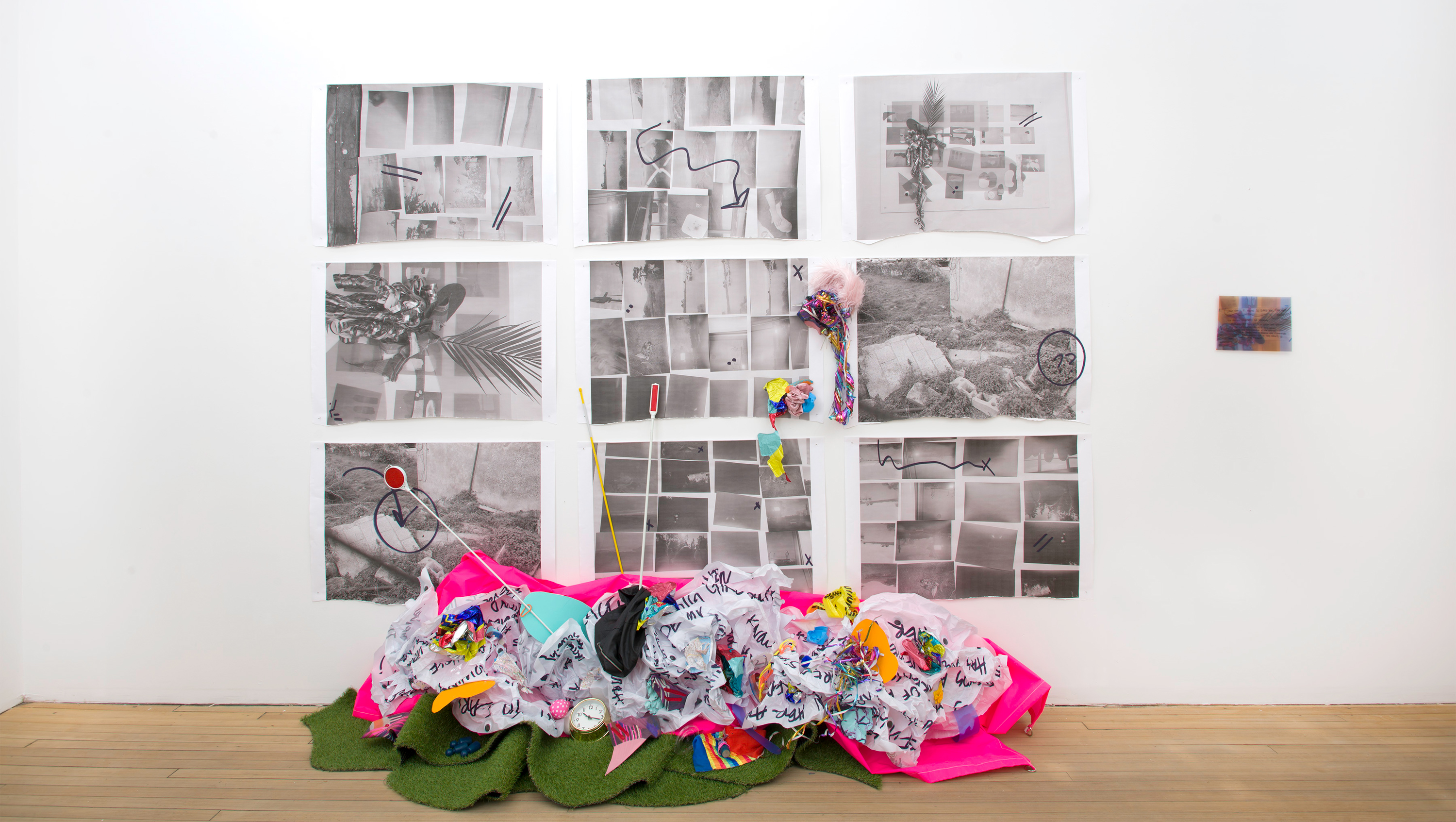 In-gallery collage of nine paintings