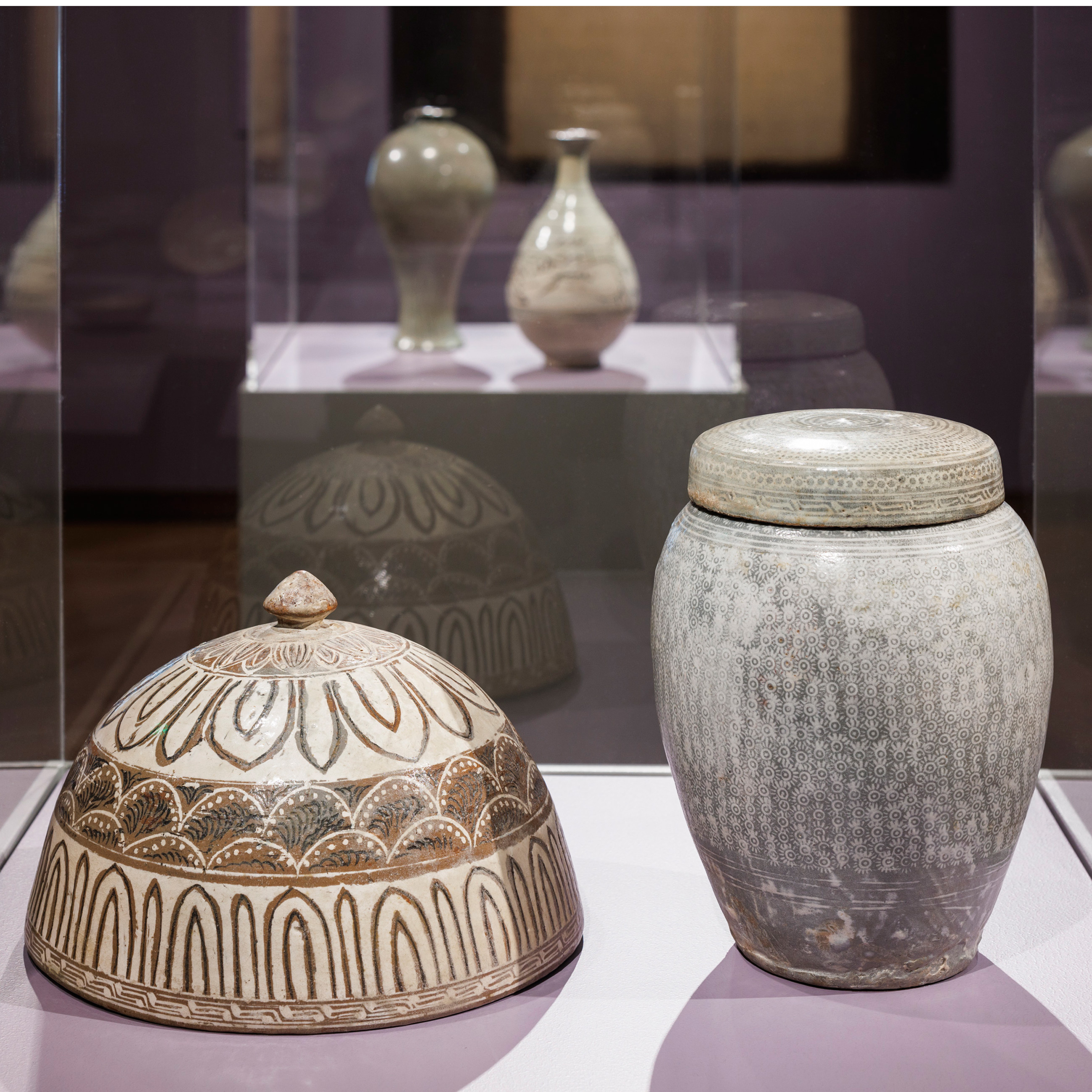 lid and jar in a glass case in Perfectly Imperfect exhibition