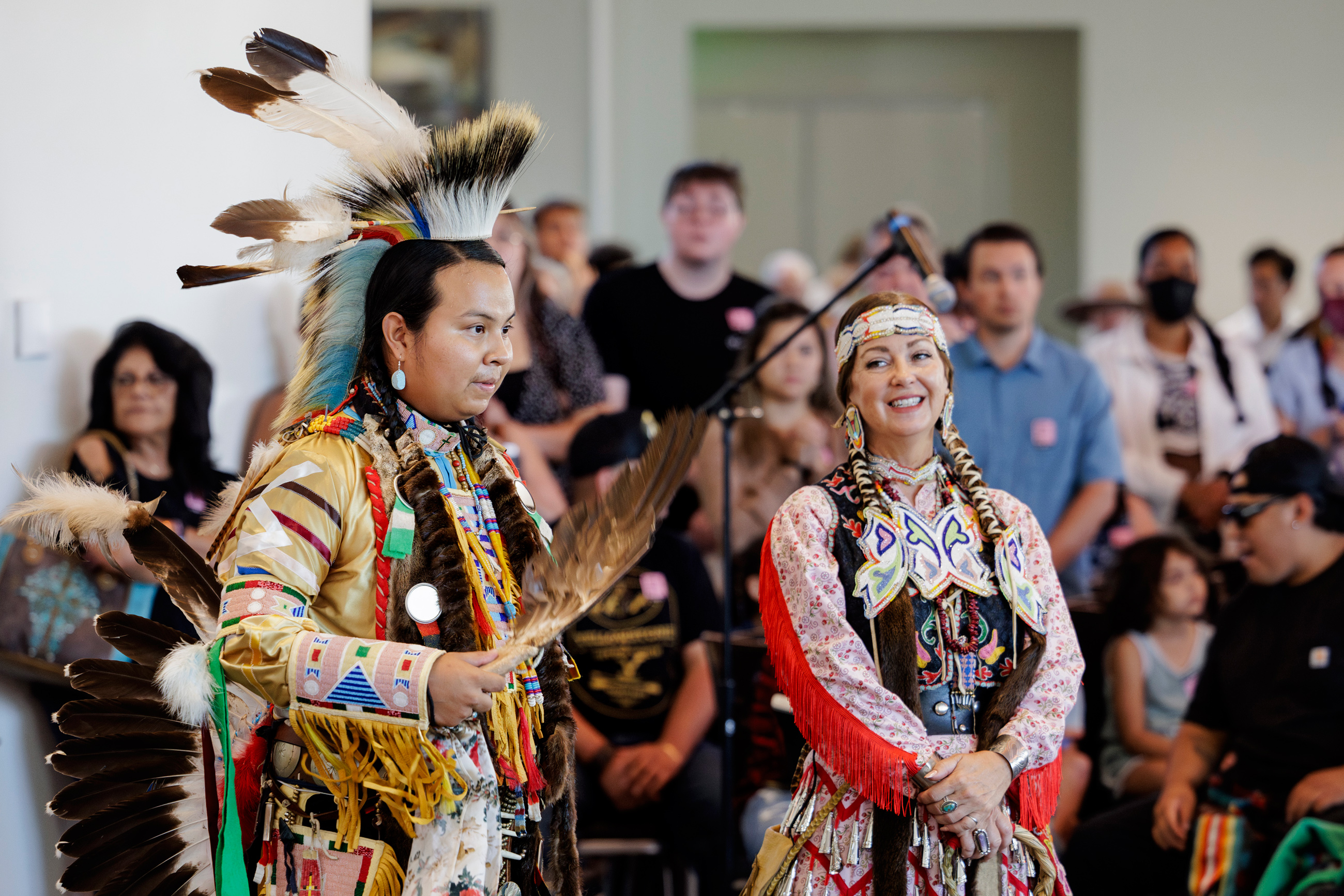 A man and woman performing at Powwow