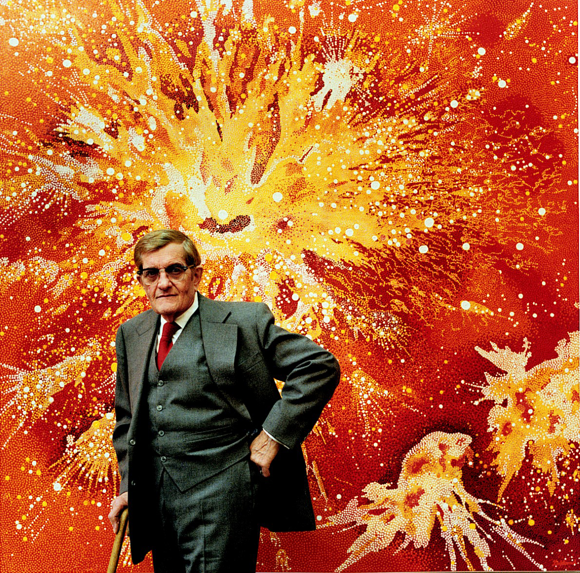 Vance Kirkland figure in front of one of his paintings