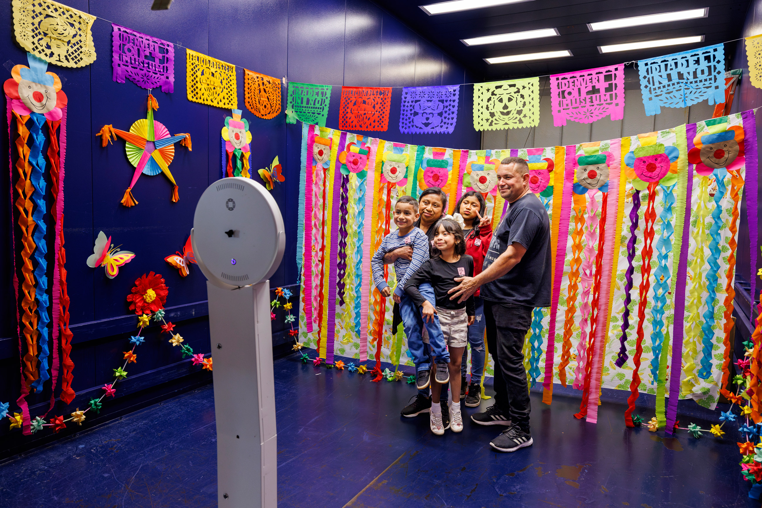 Family of visitors posing for a group photo at Dia Del Nino in 2024