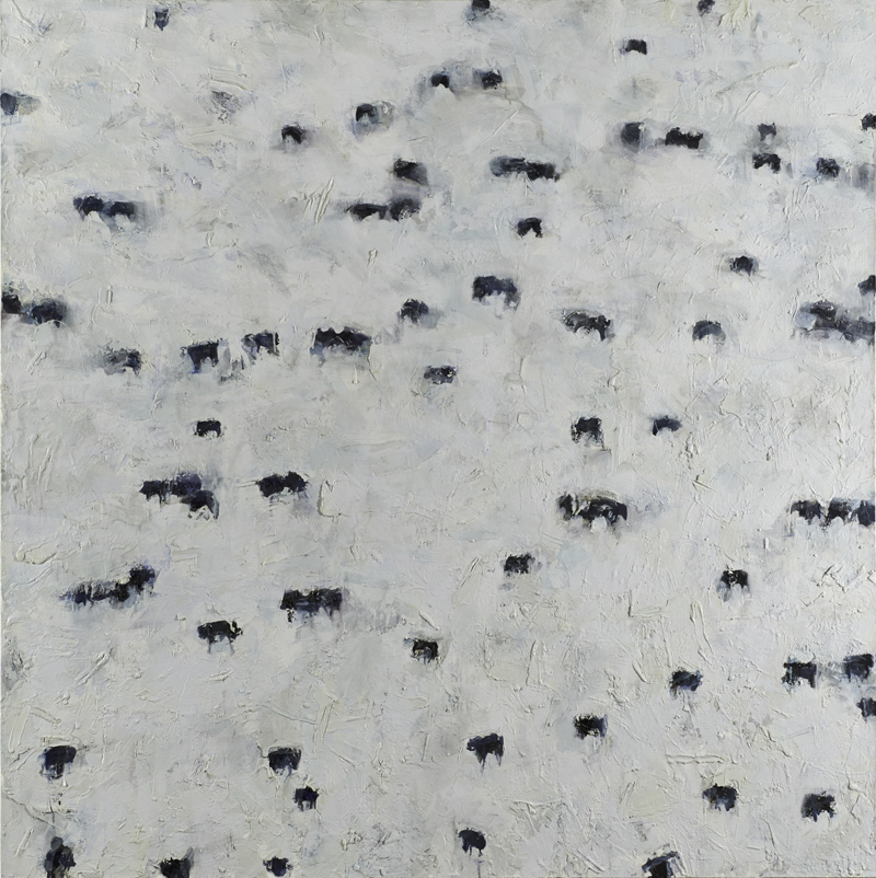 Overhead view of a snowy plain of buffalo