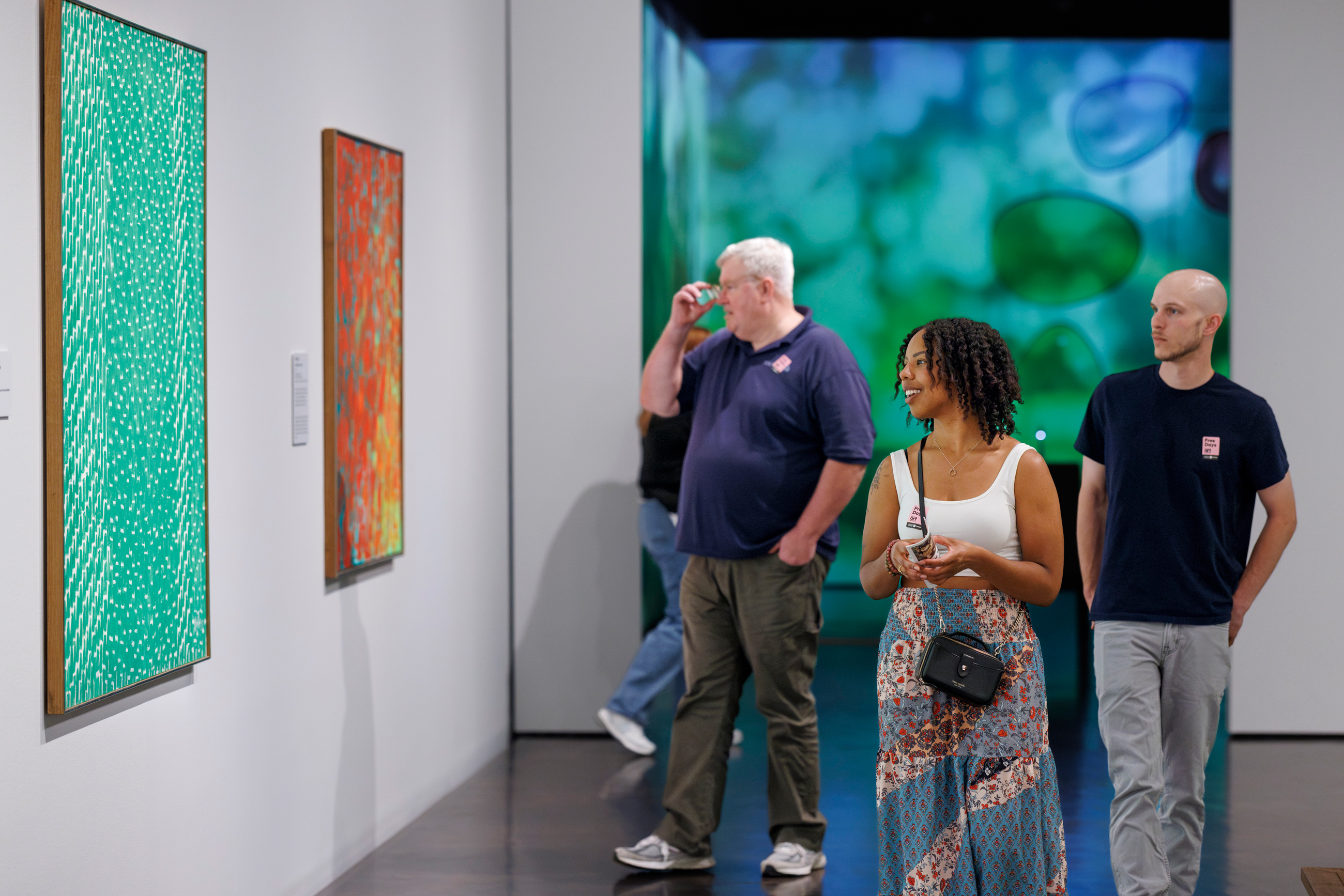 Visitors looking at art