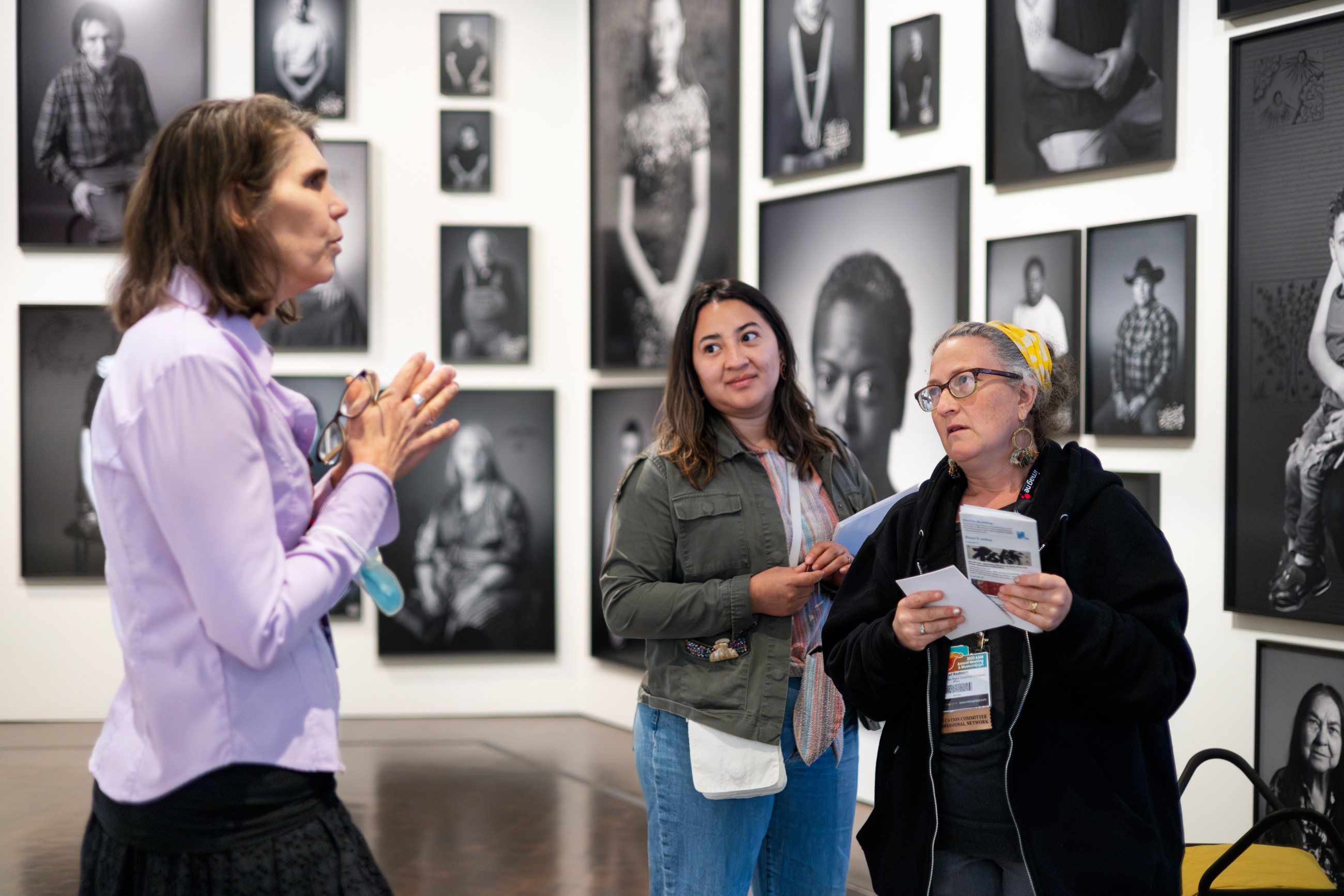 Two women getting a tour from a docent