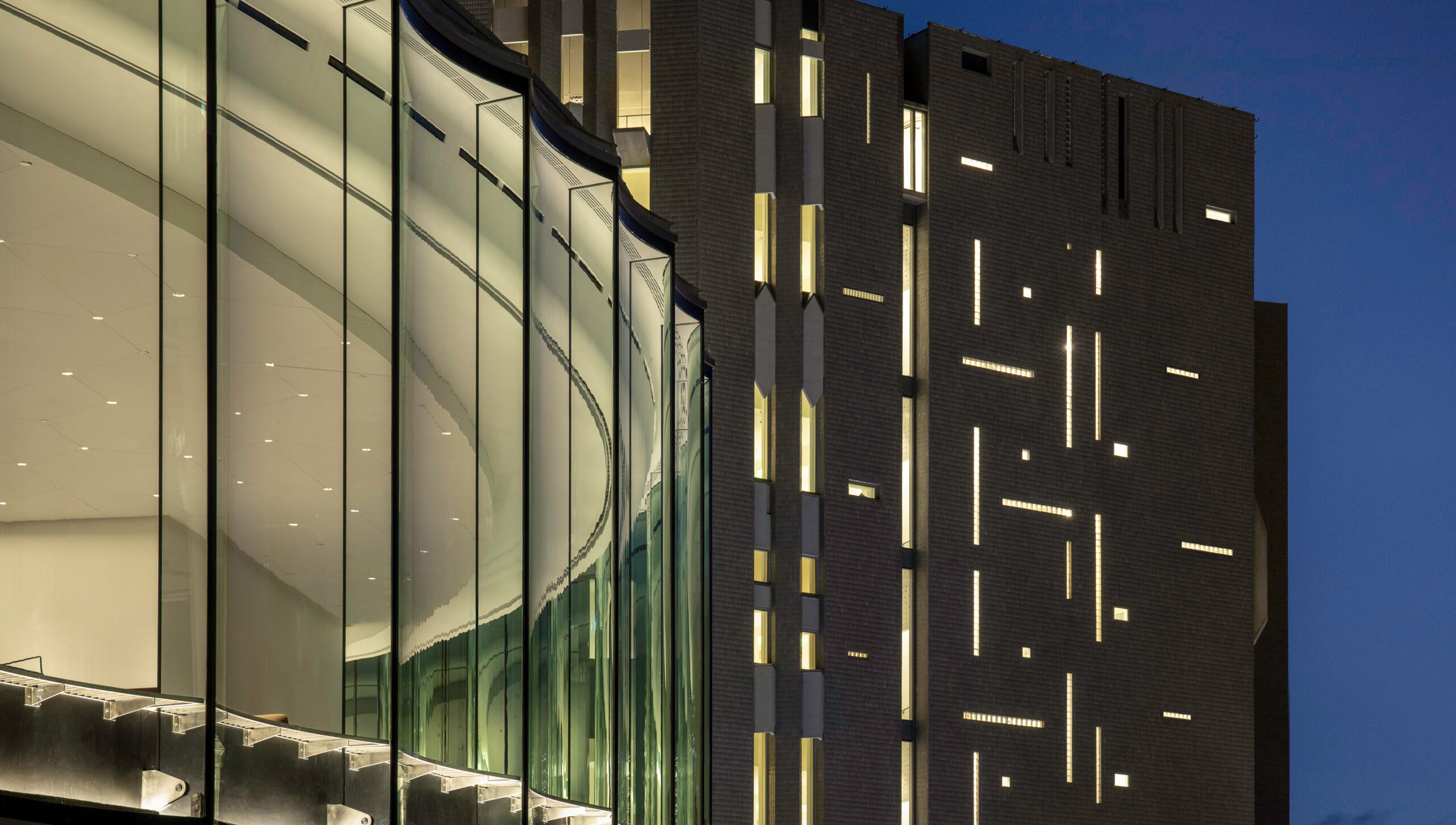 Nighttime exterior view of the Sie Welcome Center and Martin Building