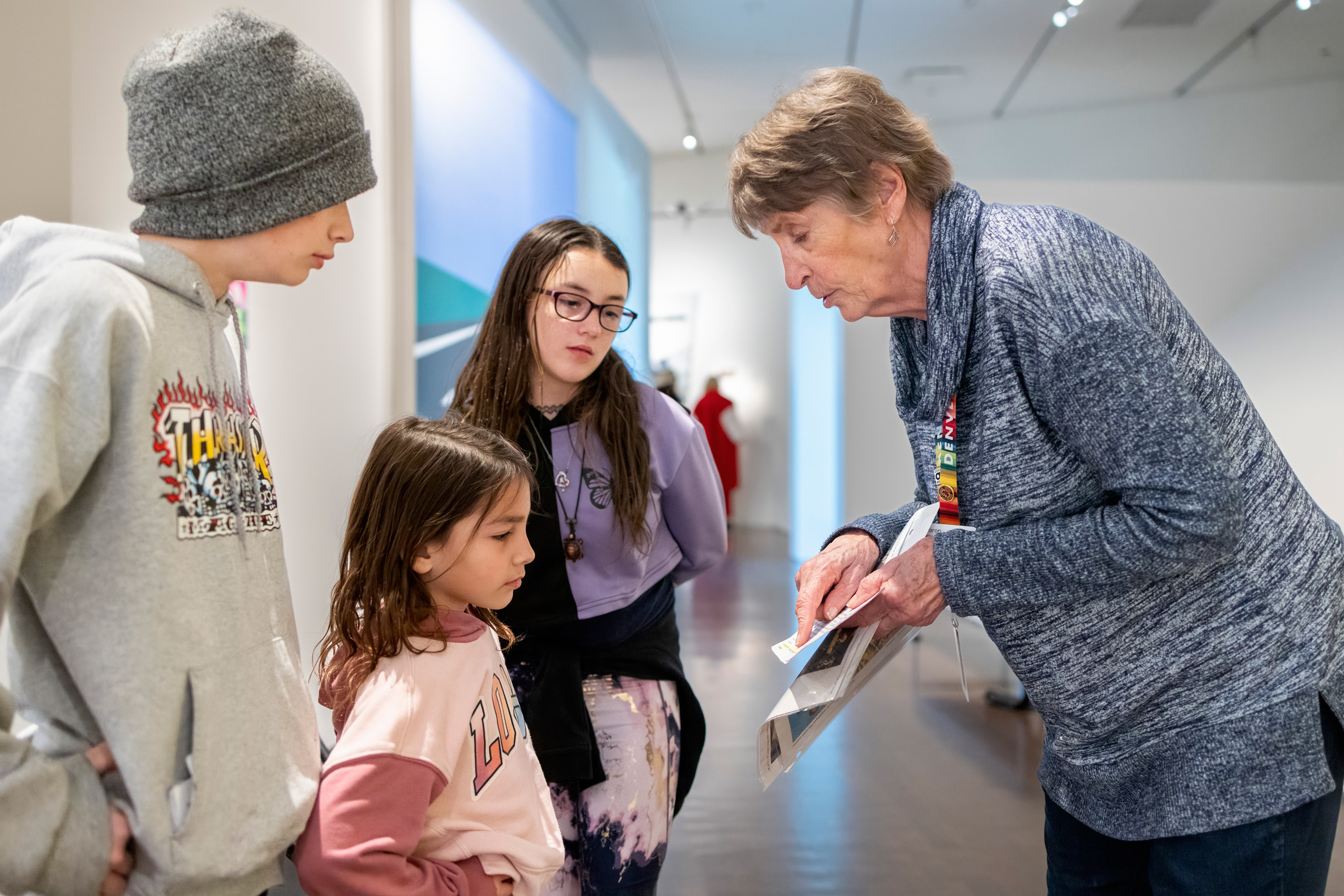 Docent explaining an artwork to kids
