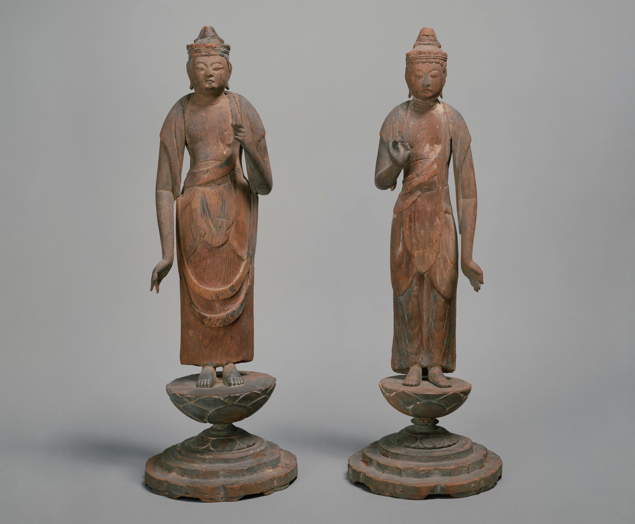 Two statutes of stoic Japanese figures
