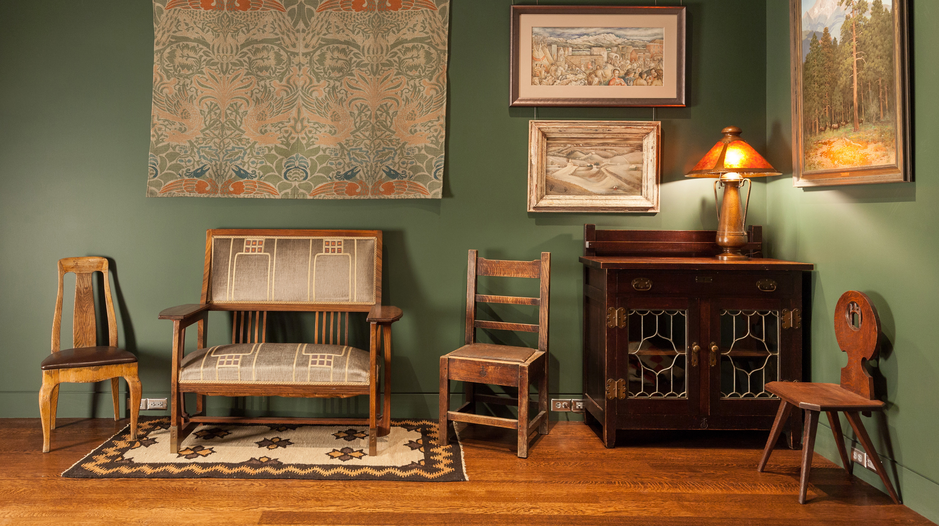 Interior view of the salon style presentatino of artworks, objects, and furniture at the Kirkland