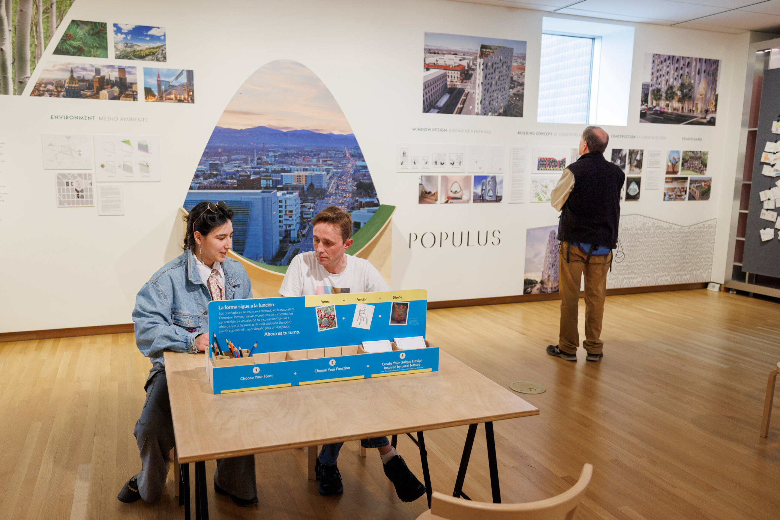 Guests laughing while making art in the design studio