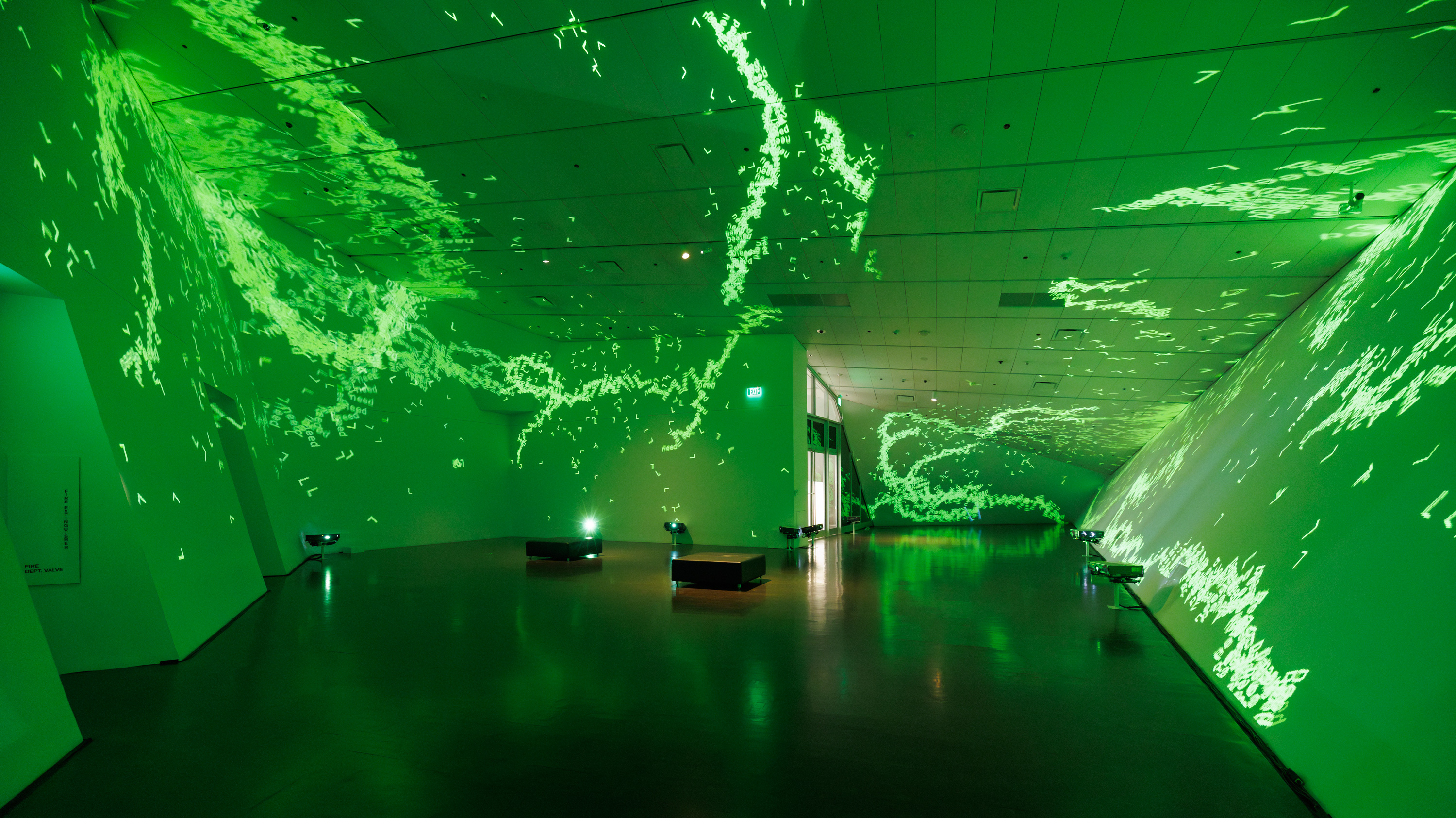 Green laser lights in an empty projection room