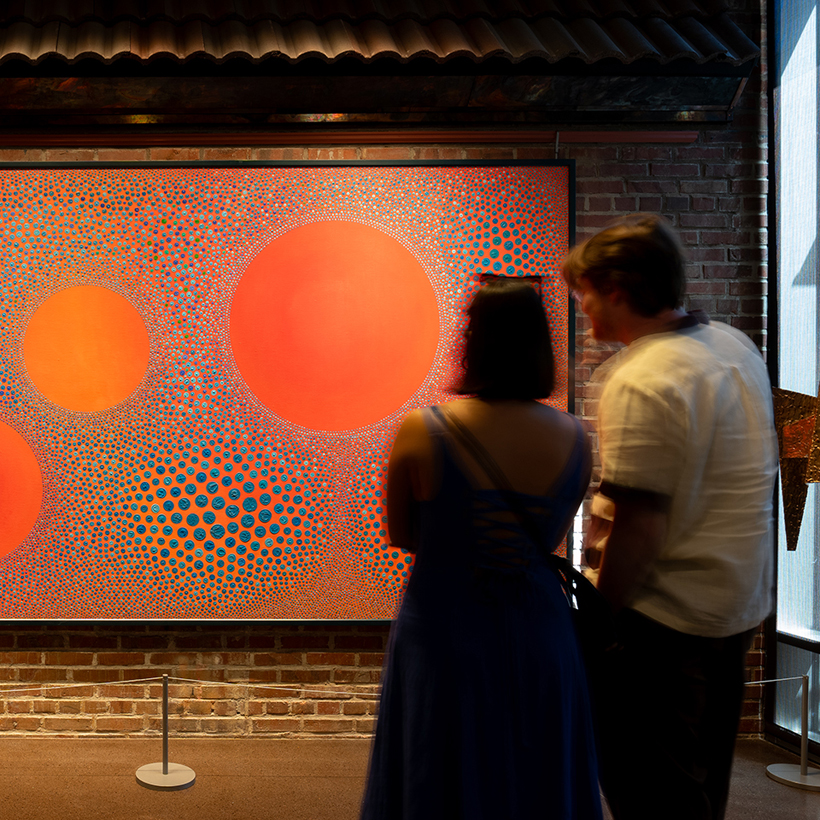 Couple looking at Kirkland dot painting