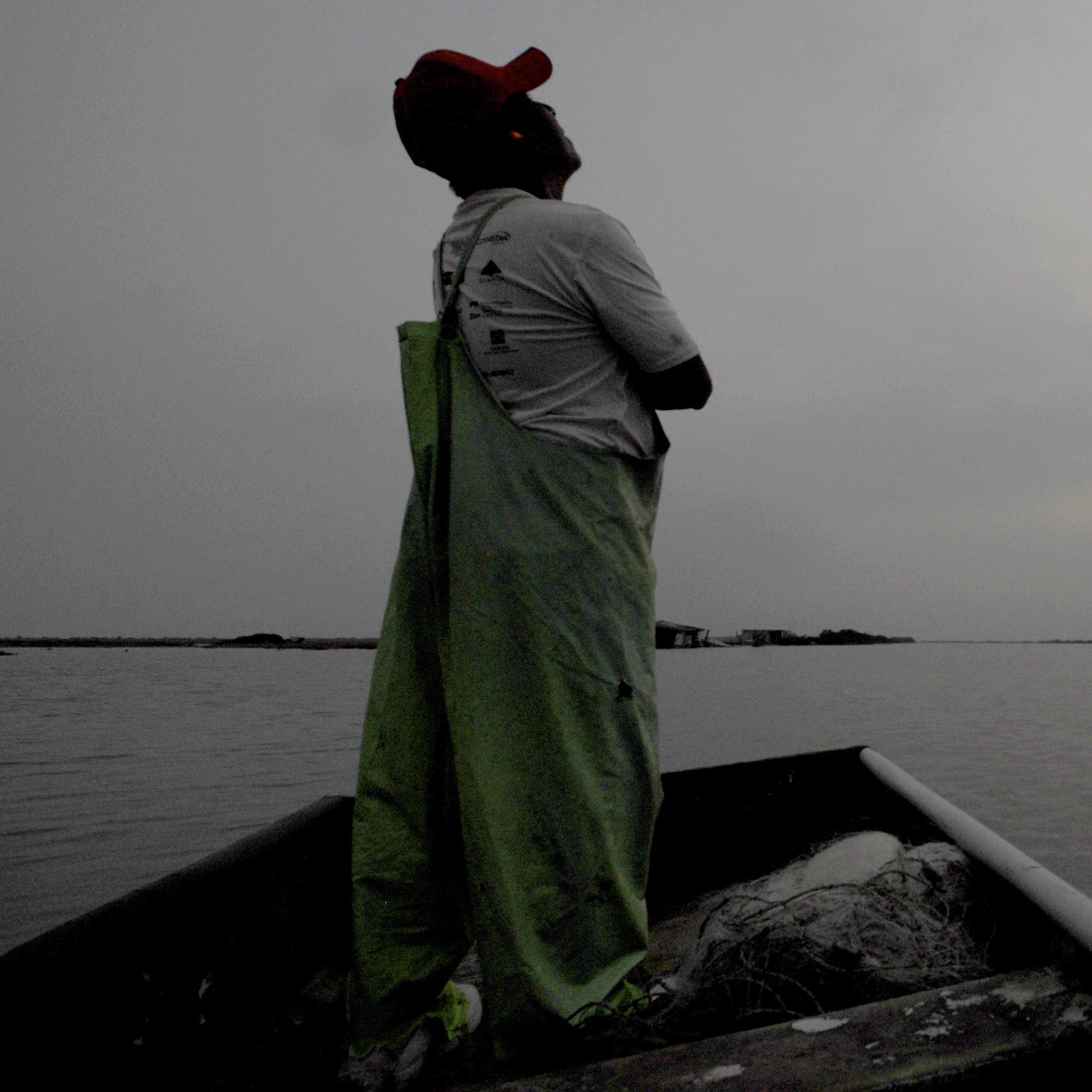 Man staring up to the gray sky