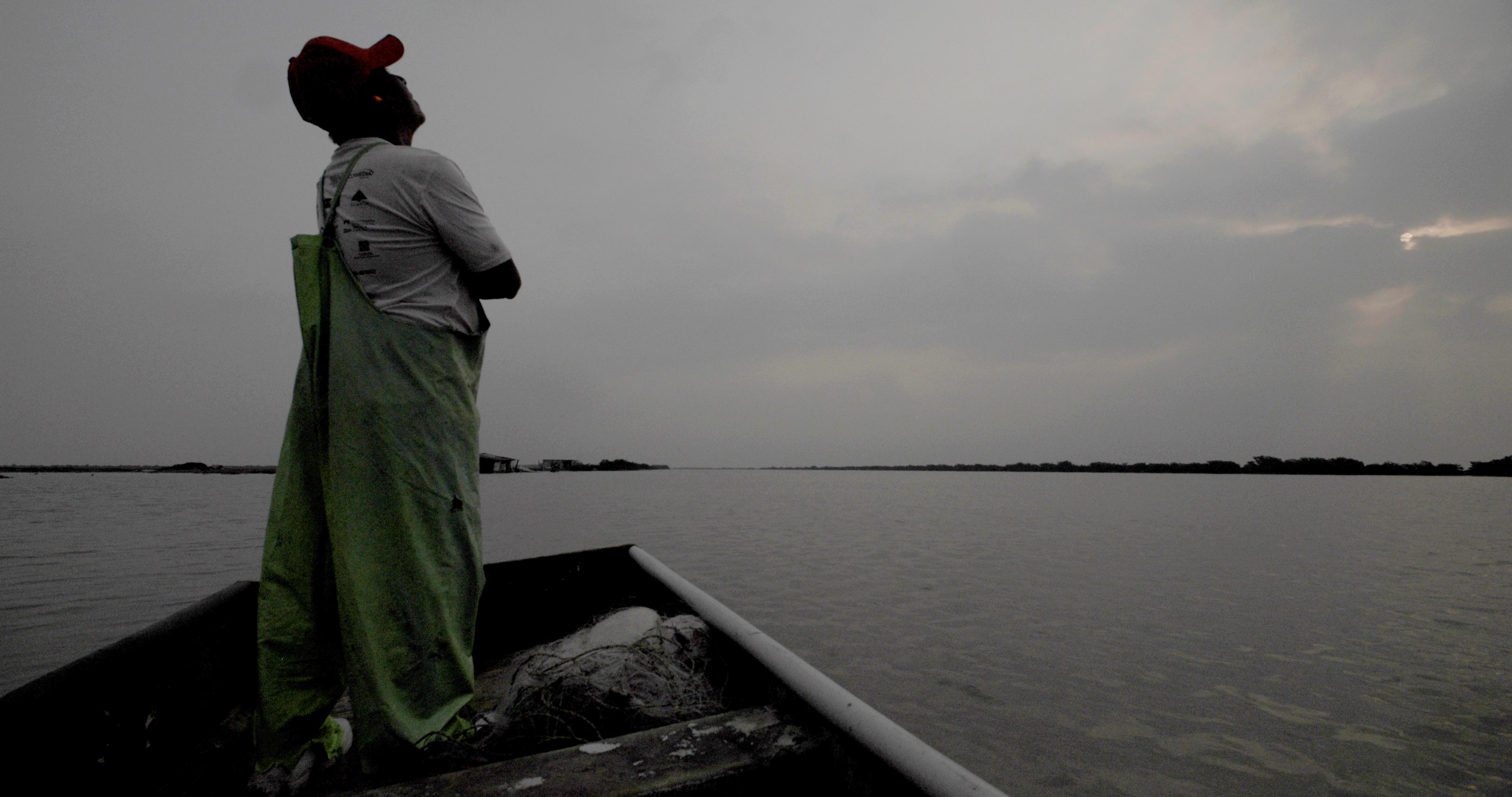 Man staring up to the gray sky