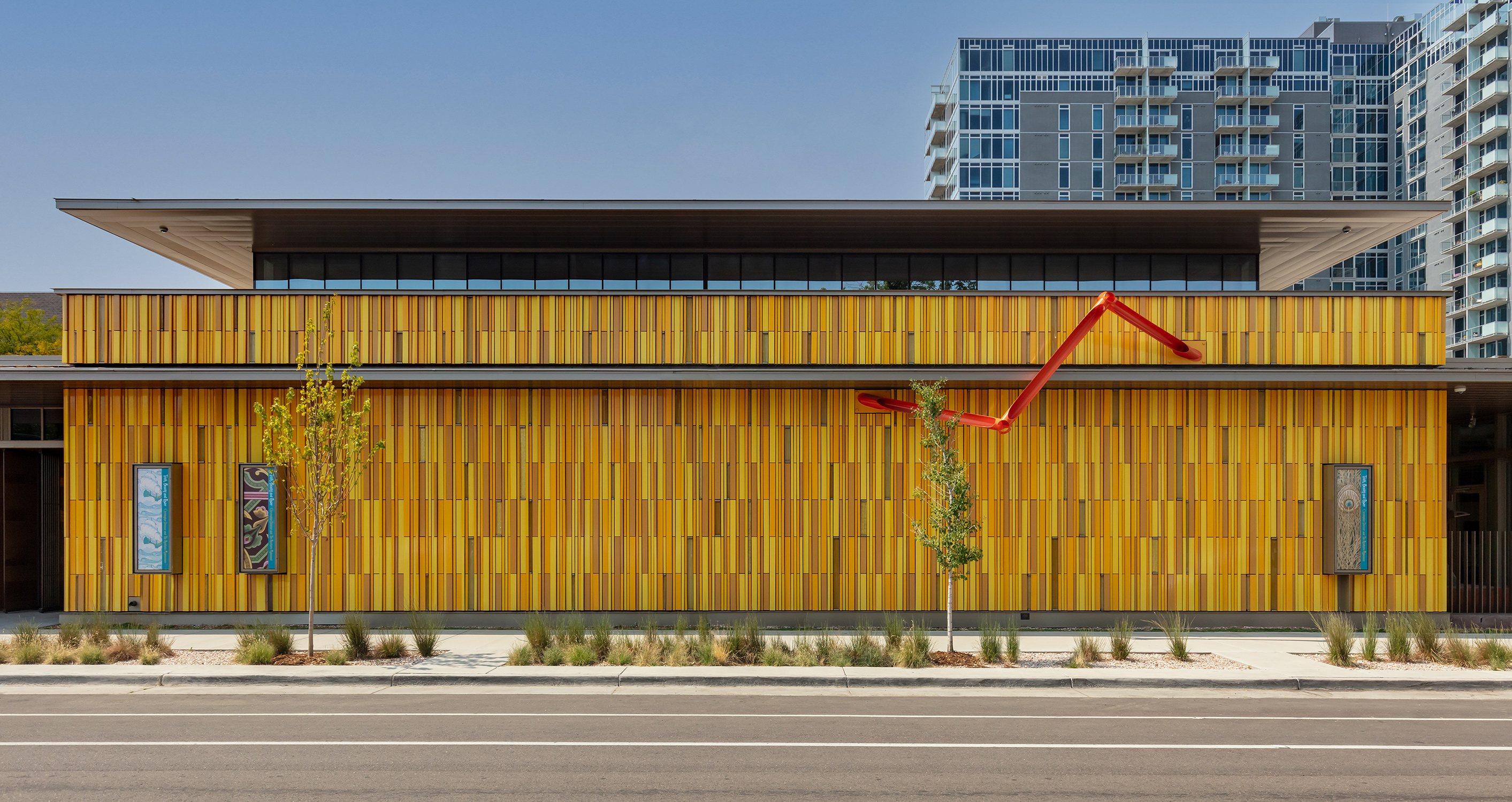 Bright yellow tiles cover the exterior of The Kirkland building.