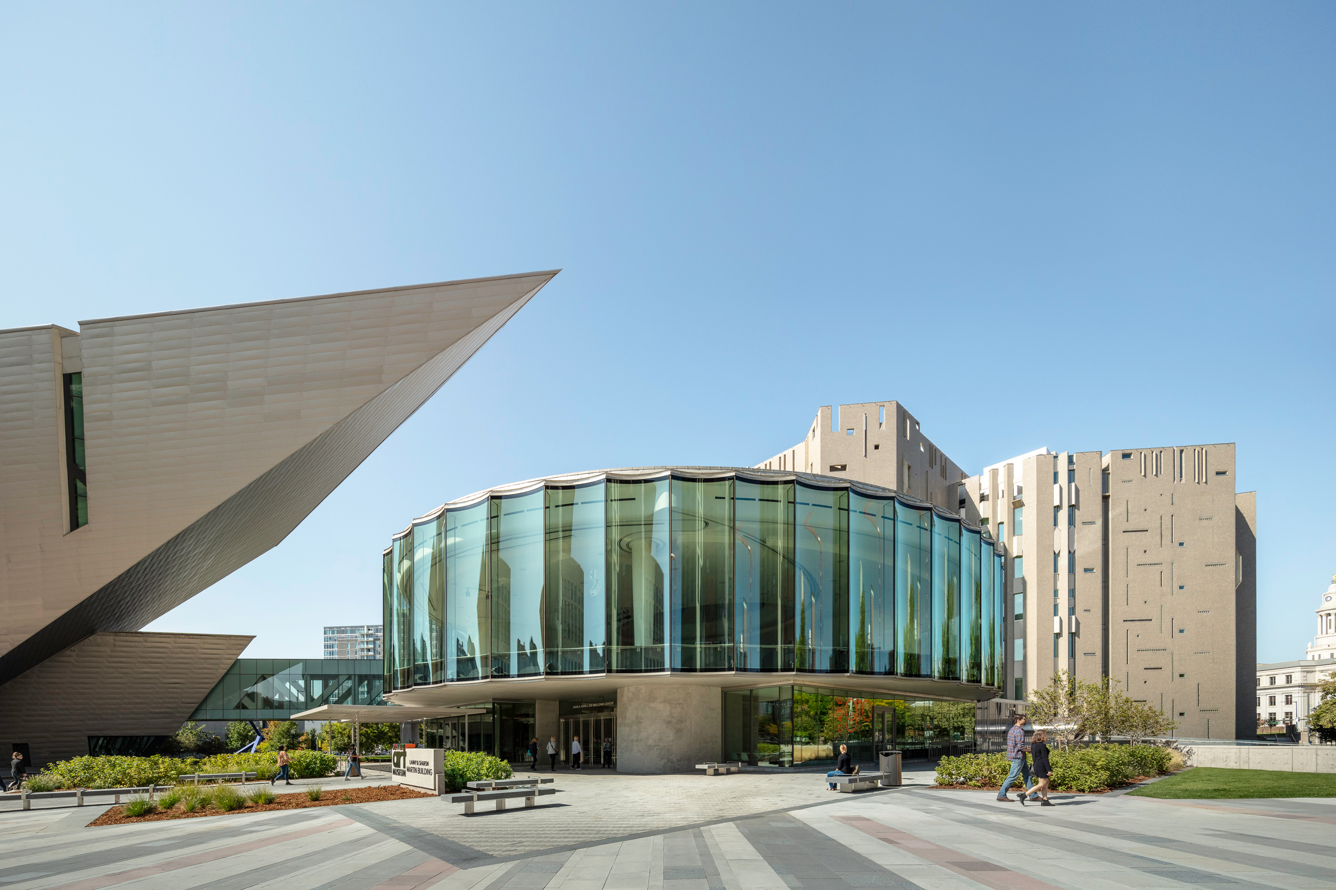Wide view of the Martin Building with guests walking