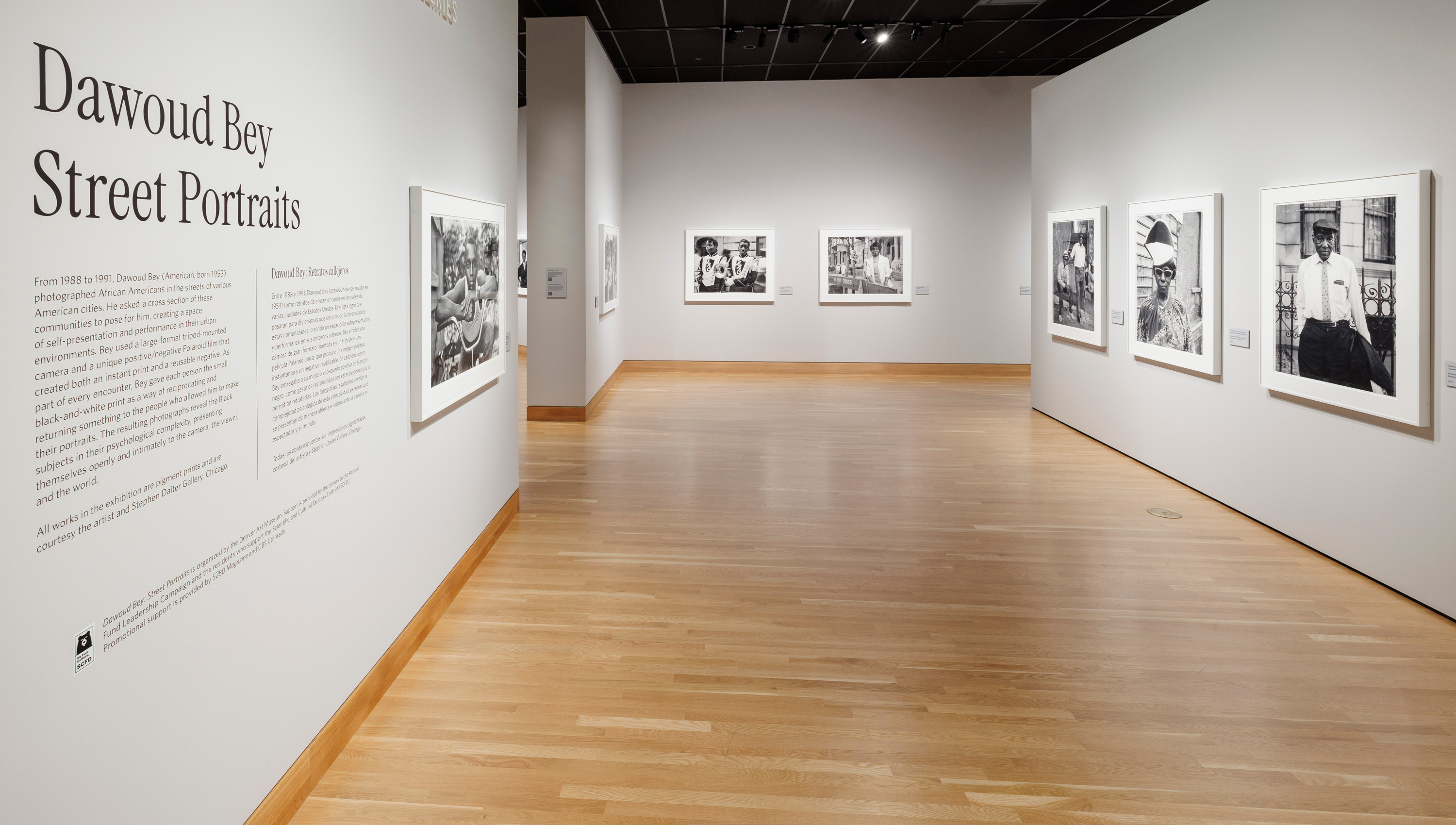 gallery text and black and white photos on the walls