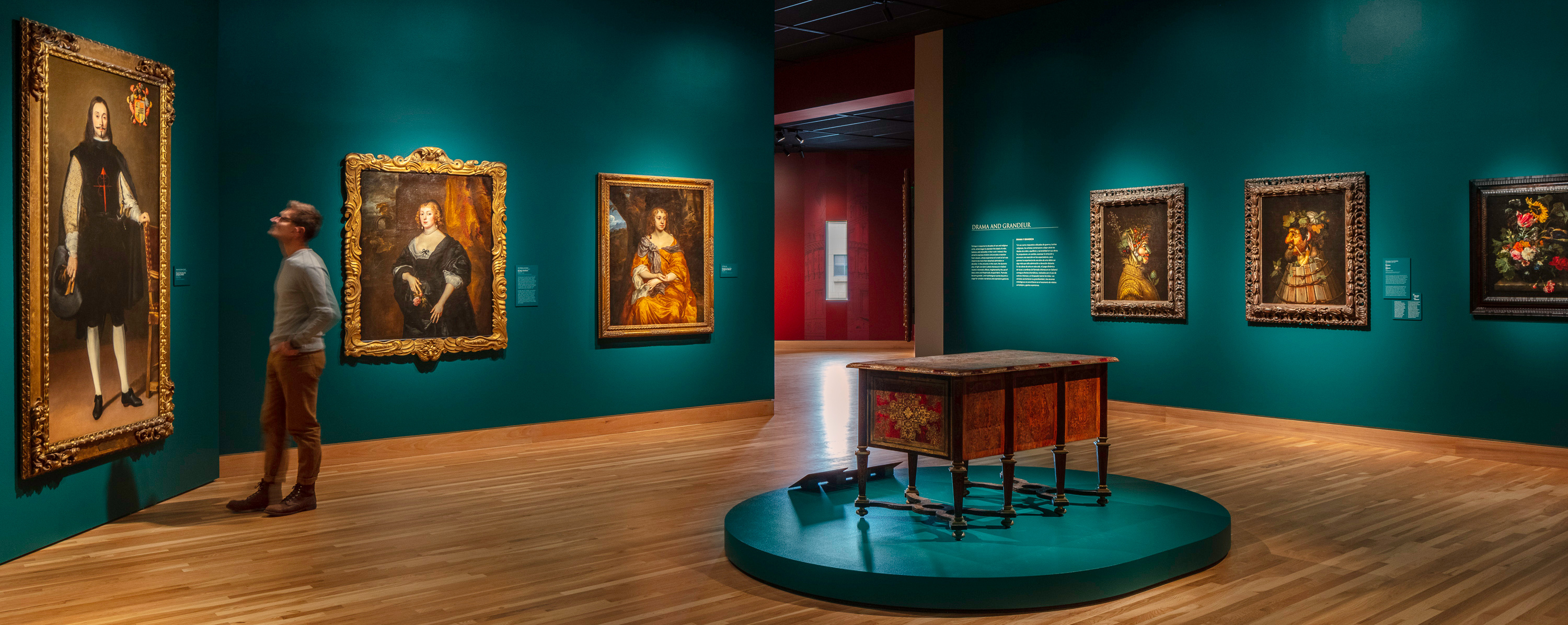 Man looking at European paintings