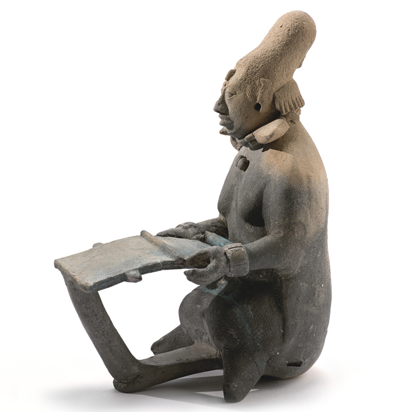 Side profile of statue siting in repose