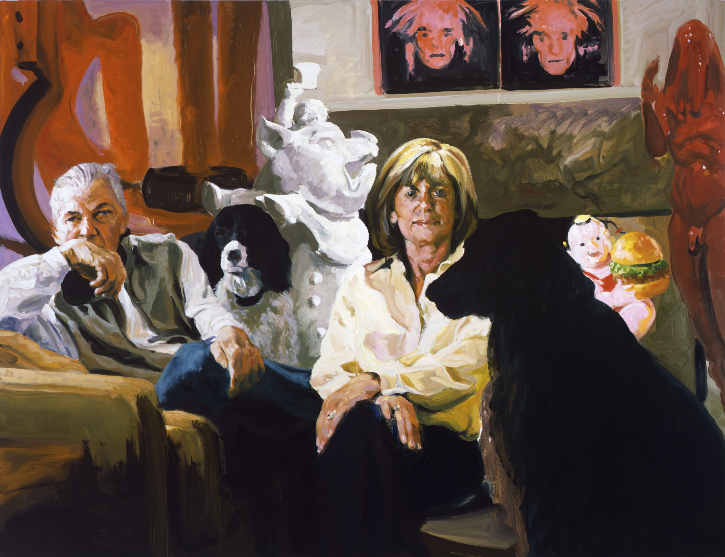 Portrait of Kent and Vicki Logan in their home with their two black dogs